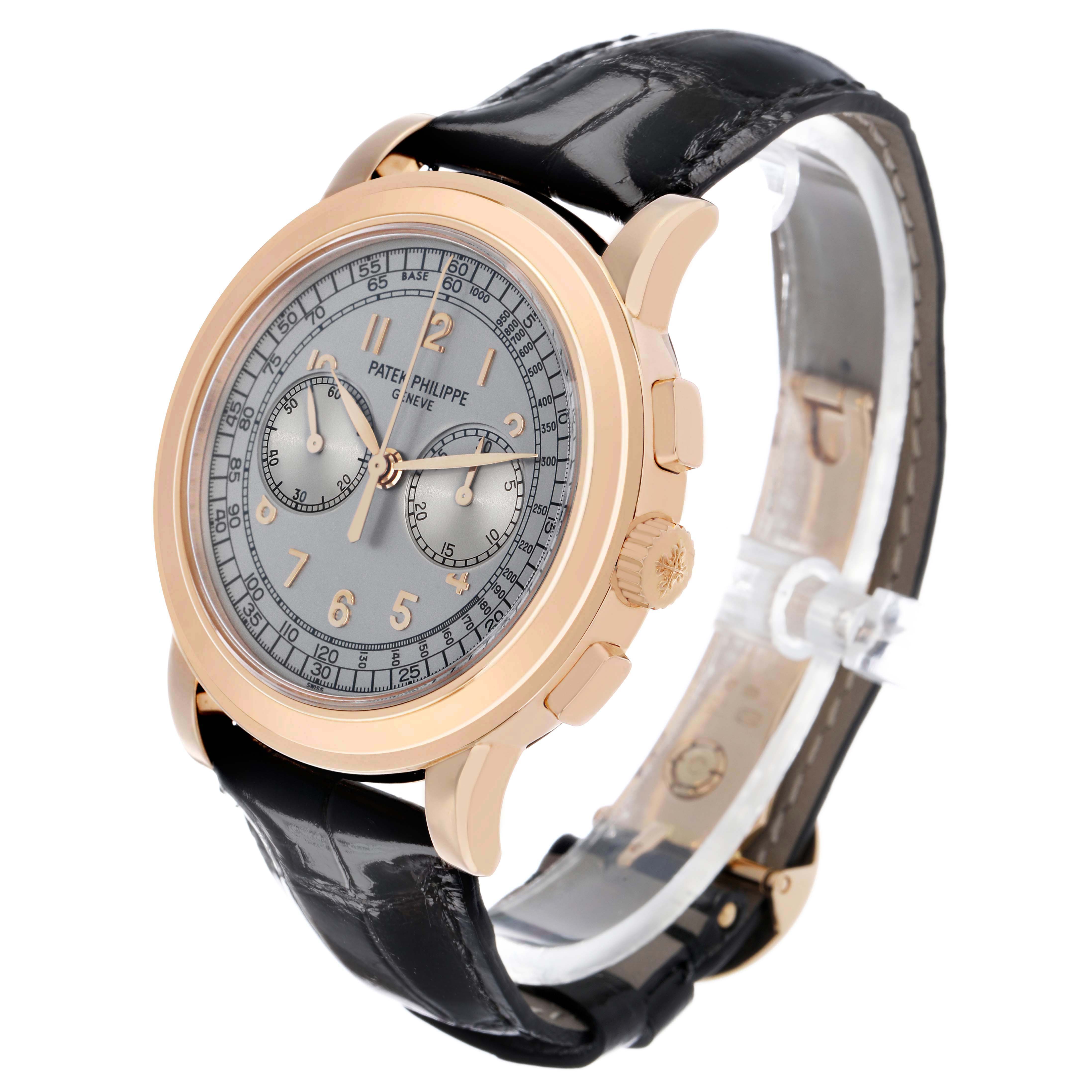 The Patek Philippe Complications 5070R-001 Men's Rose Gold Silver Dial watch is shown at a three-quarter angle, highlighting the dial, case, and black leather strap.