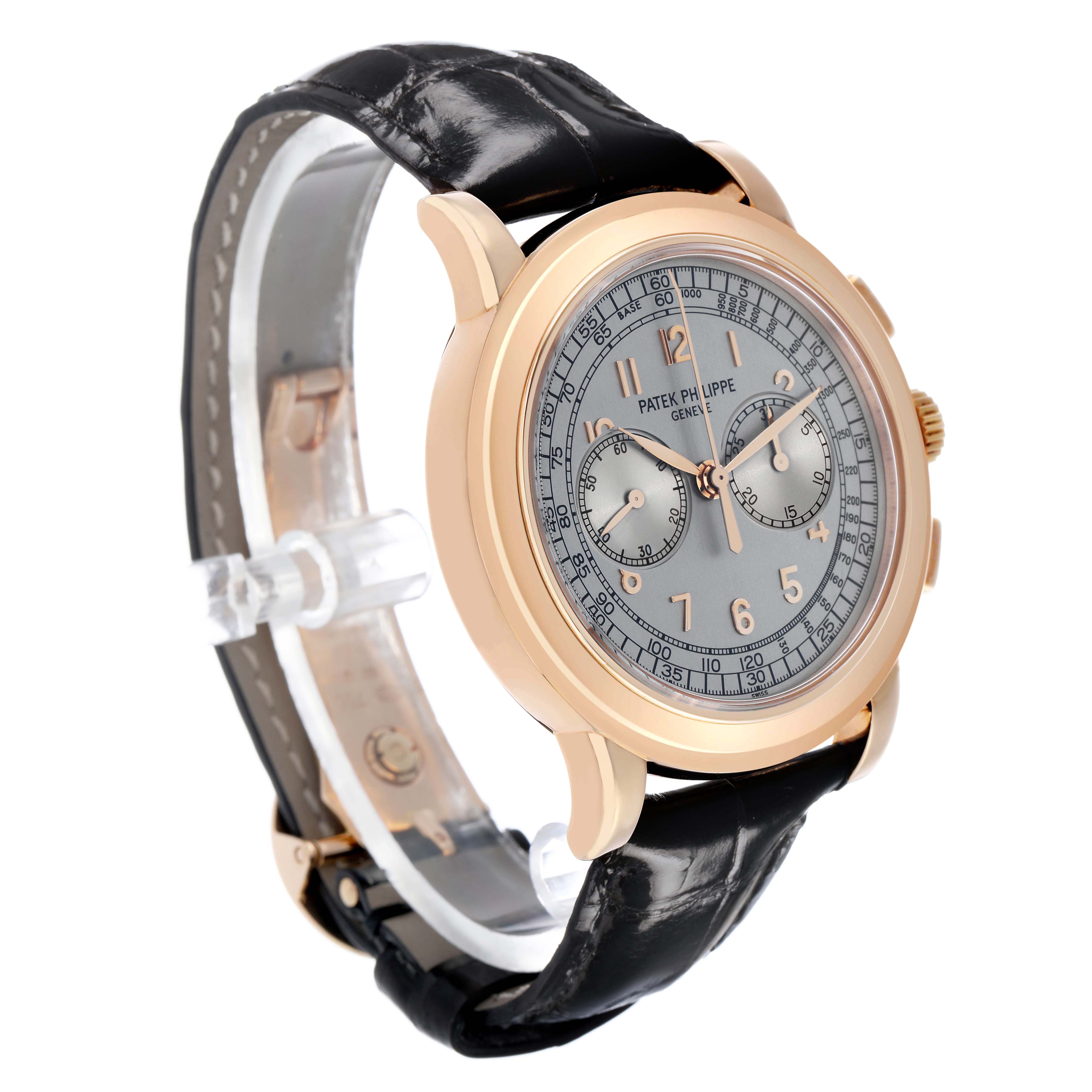 The Patek Philippe Complications 5070R-001 Men's Rose Gold Silver Dial watch is shown at a three-quarter angle, displaying the dial, case, and leather strap.