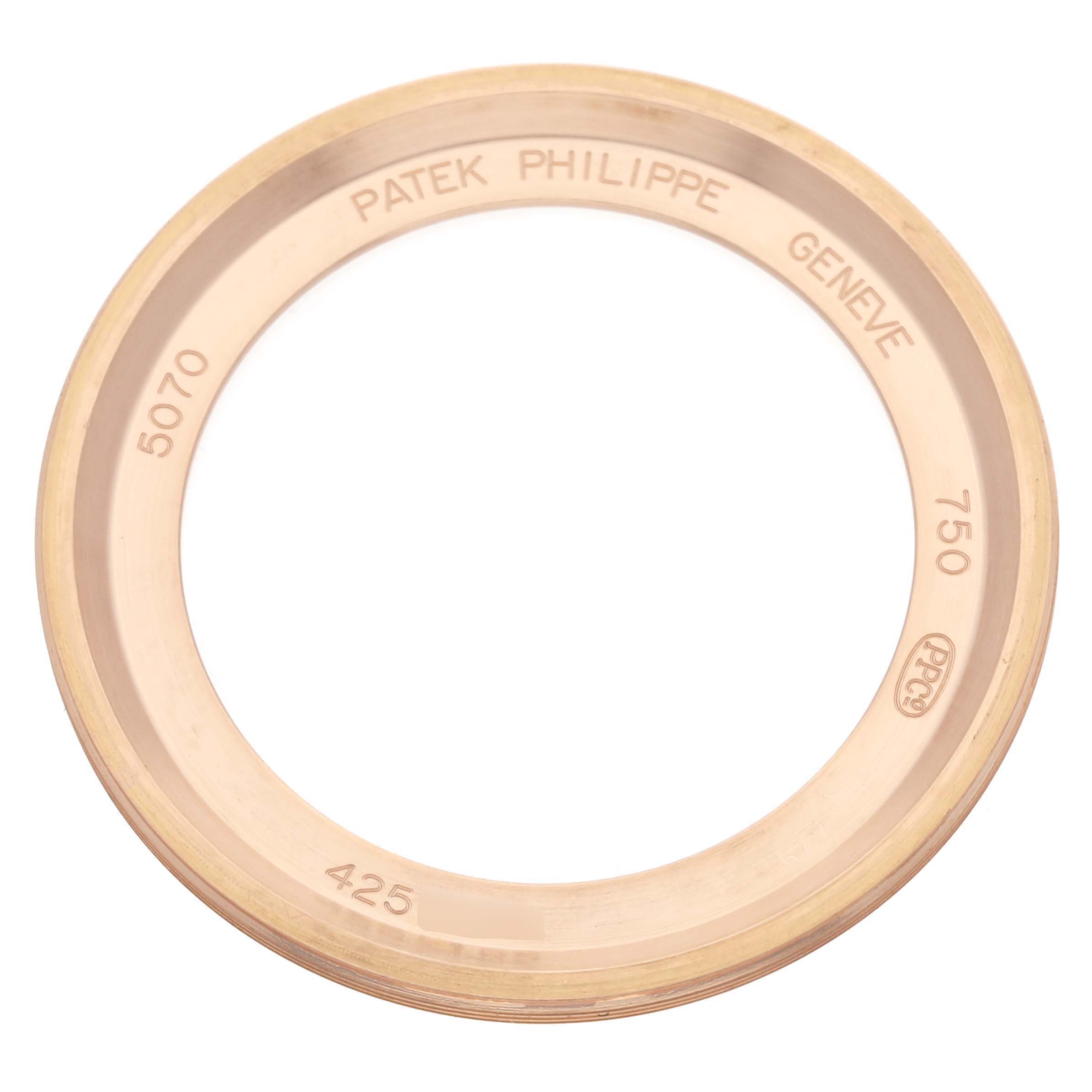 The image shows a gold bezel for a Patek Philippe Complications 5070R-001 Men's Rose Gold Silver Dial model, viewed from above, with engravings.