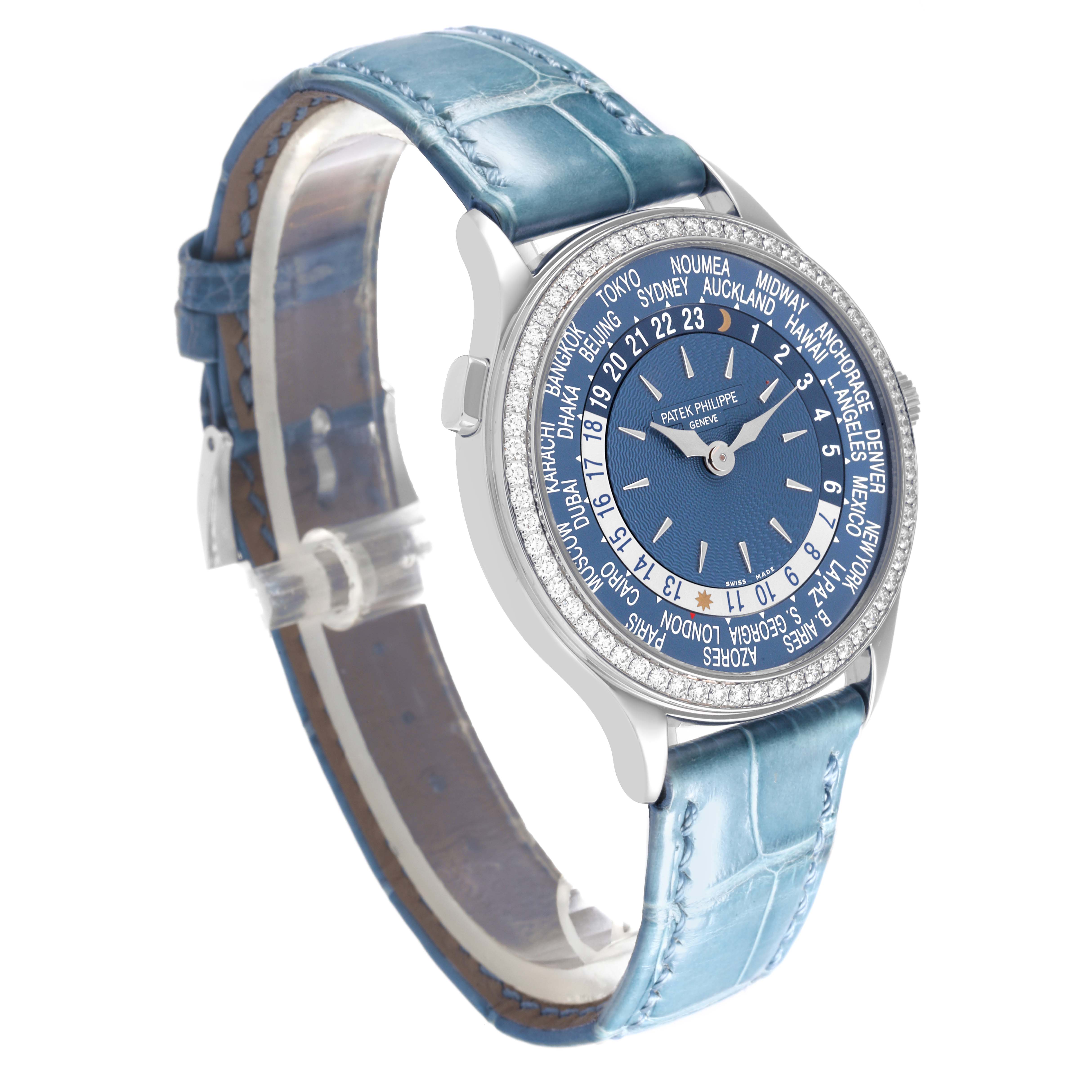 The Patek Philippe Complications 7130G-016 Men's White Gold Blue Dial 7130G-016 Men's White Gold Blue Dial watch is shown at an angled side view, highlighting its dial, bezel, and blue leather strap.