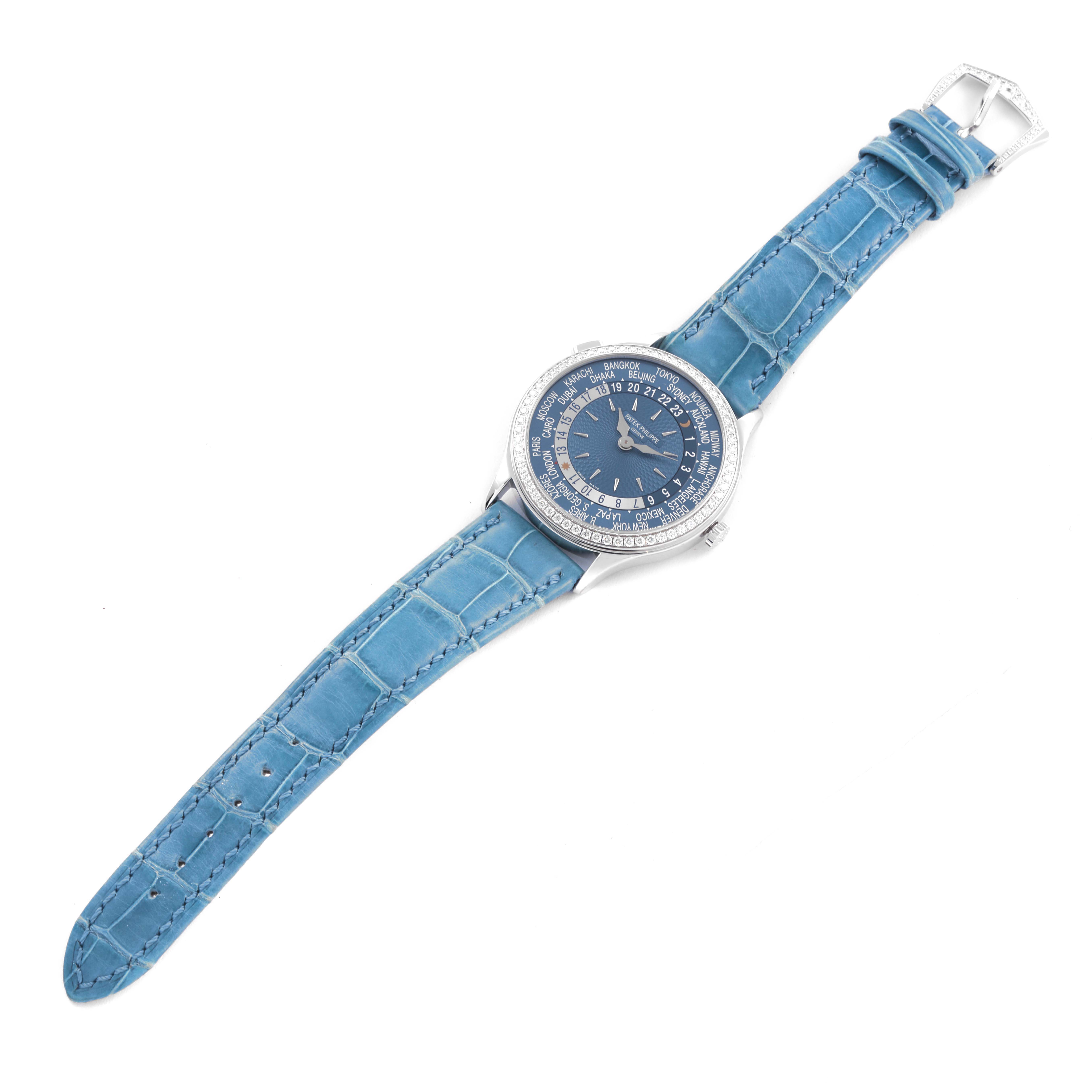 The image shows a Patek Philippe Complications 7130G-016 Men's White Gold Blue Dial 7130G-016 Men's White Gold Blue Dial watch with a top angle showcasing the dial, case, and blue alligator strap.