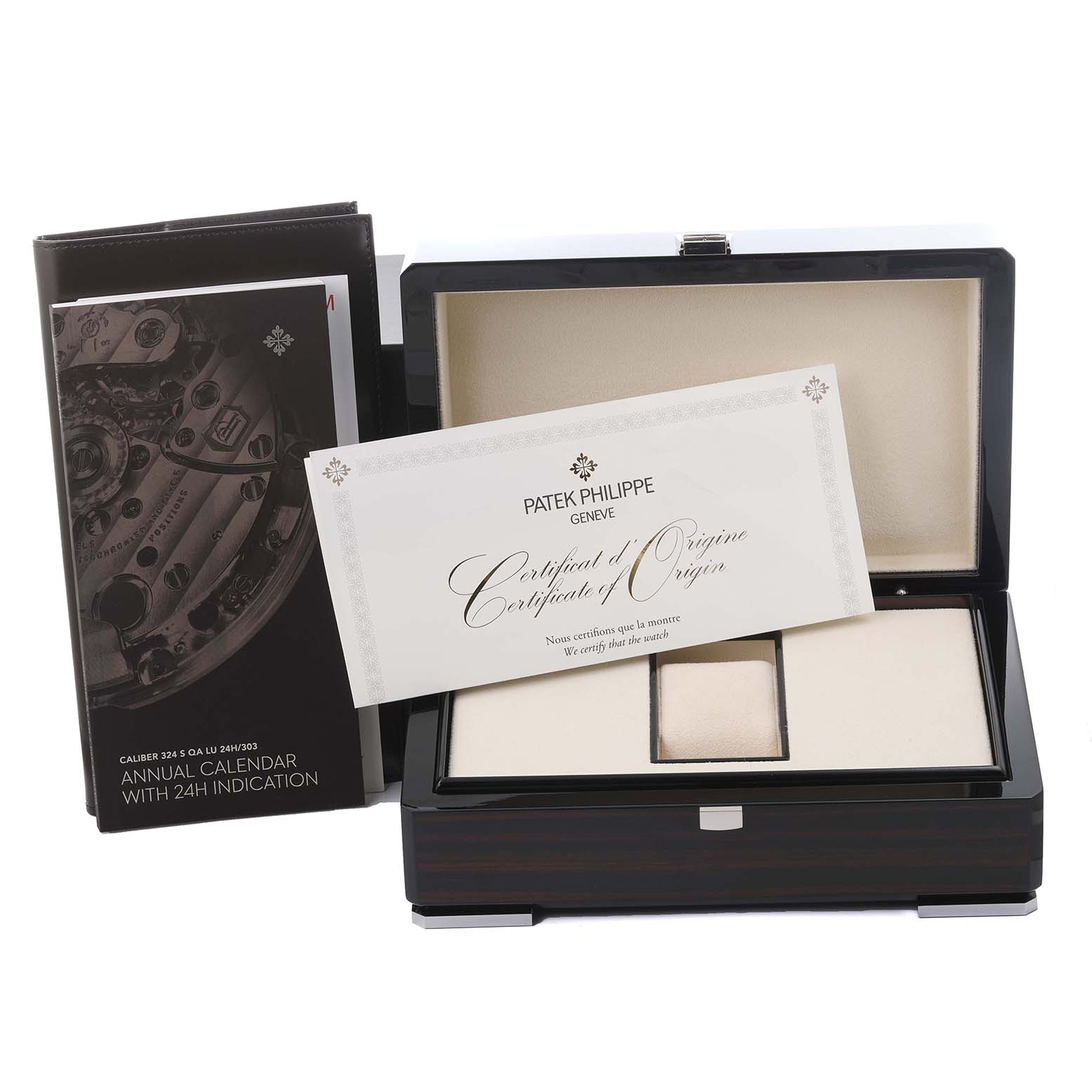 The image shows the packaging and accessories for a Patek Philippe Complications 7130G-016 Men's White Gold Blue Dial 7130G-016 Men's White Gold Blue Dial watch, including a box and documentation.