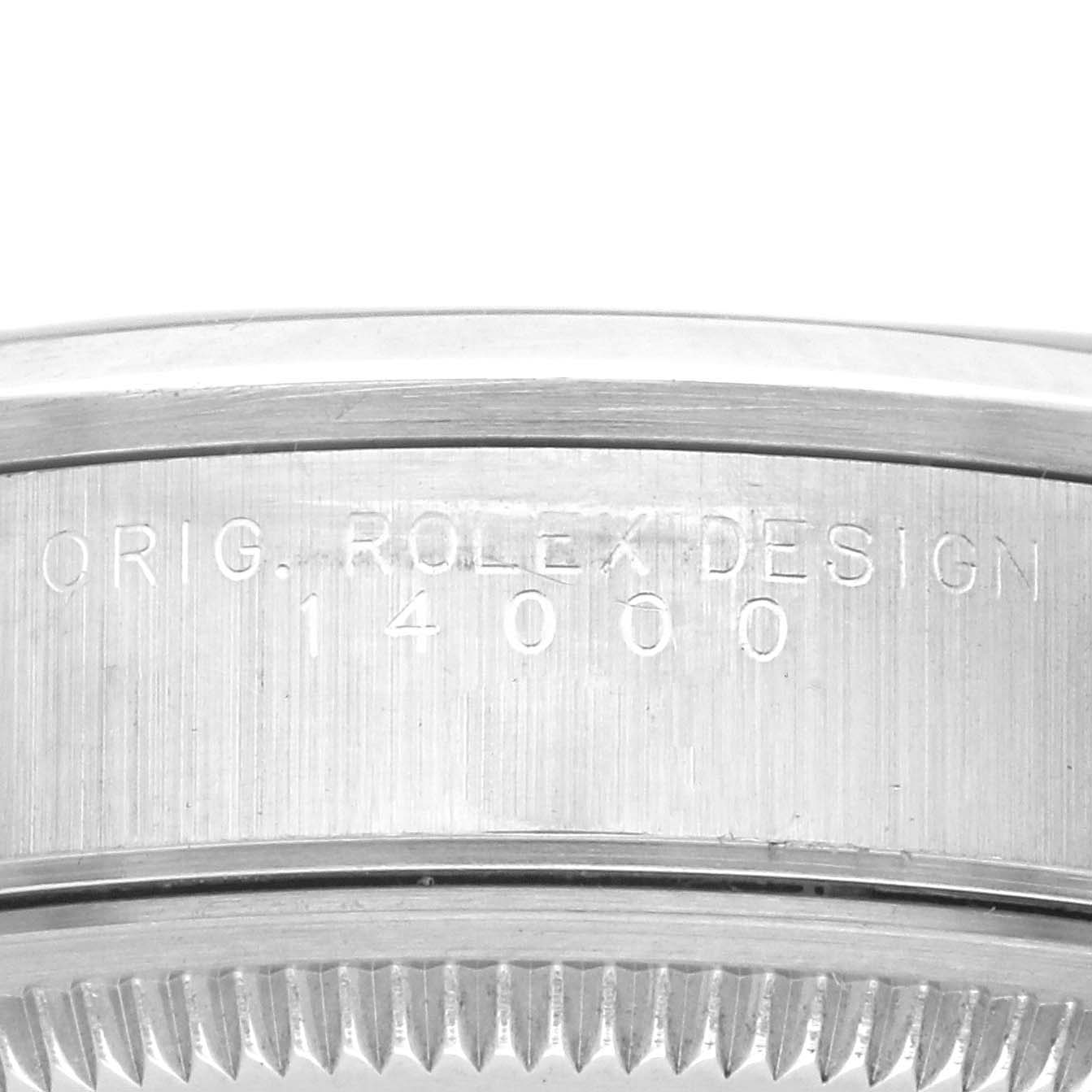 The image shows a close-up of the case edge, displaying the "ORIG. ROLEX DESIGN" engraving on the Rolex Air-King 14000 Men's Stainless Steel Blue Dial 14000 Men's Stainless Steel Blue Dial model.