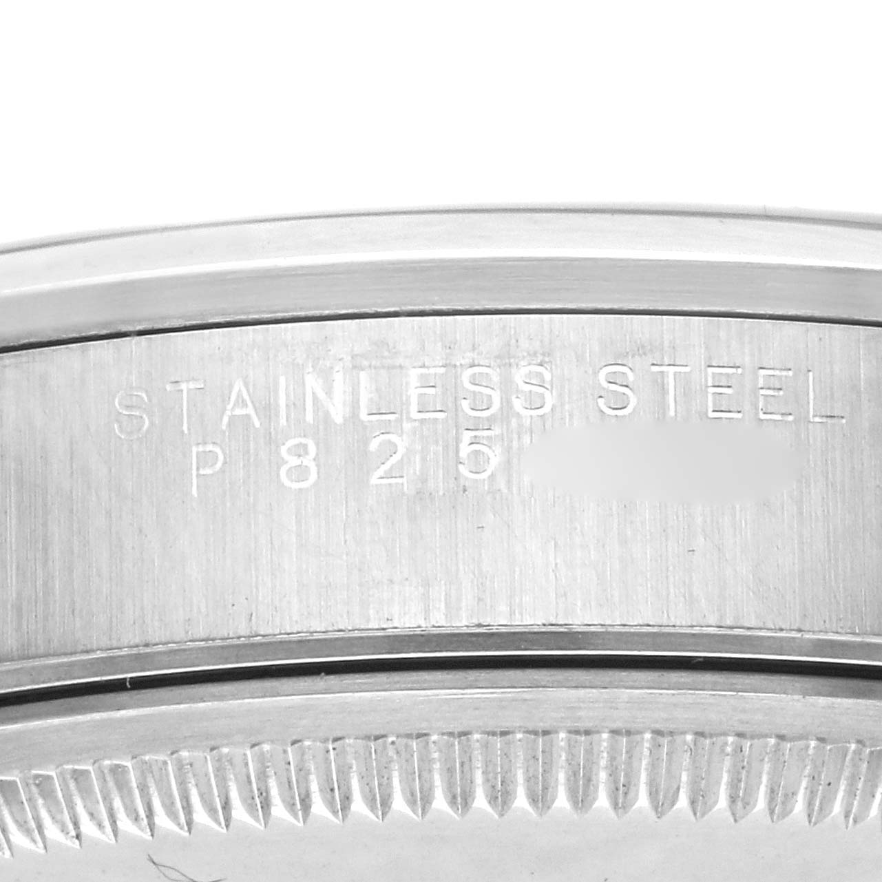 The image shows the engraved side of the stainless steel case of a Rolex Air-King 14000M Men's Stainless Steel Black Dial 14000M Men's Stainless Steel Black Dial watch.