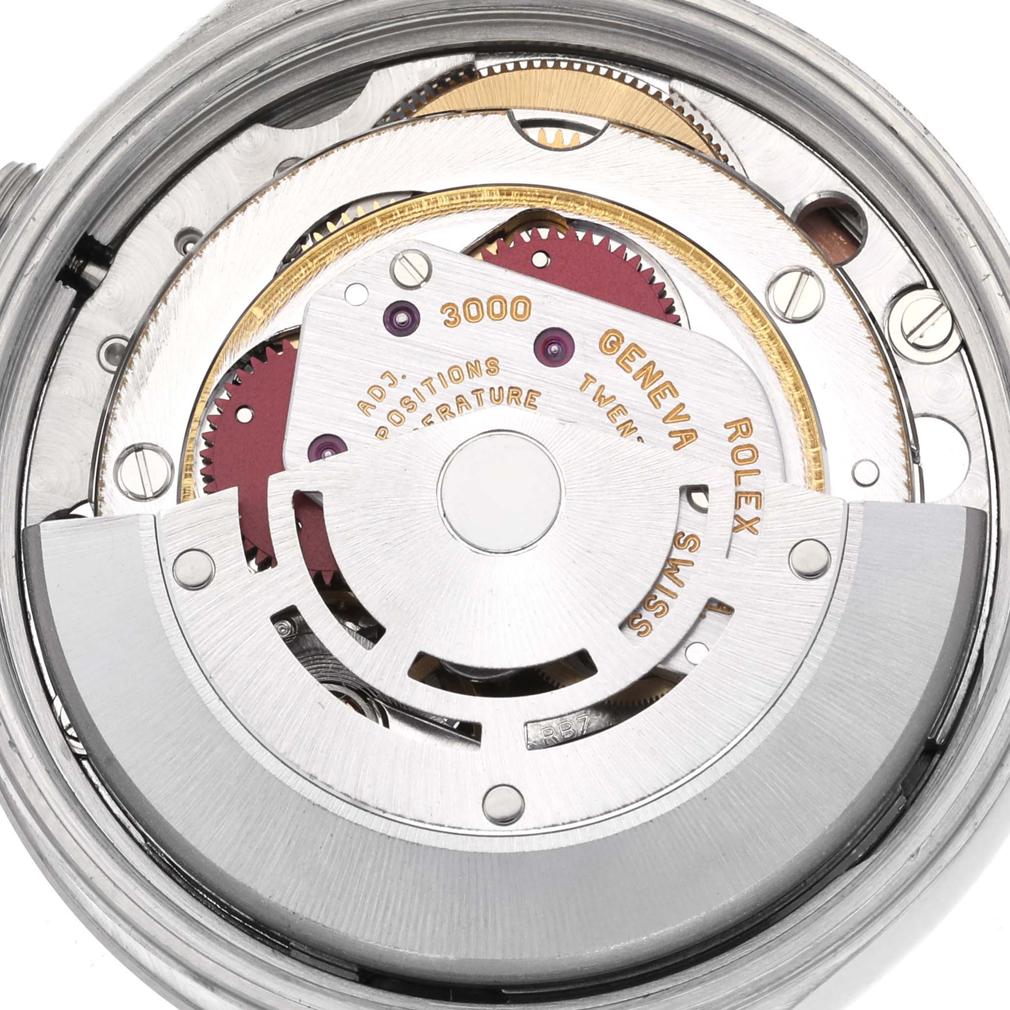 The image shows the movement mechanism of a Rolex Air-King 14000 Men's Stainless Steel Pink Dial 14000 Men's Stainless Steel Pink Dial watch from a top-down angle, revealing gears and inscriptions.