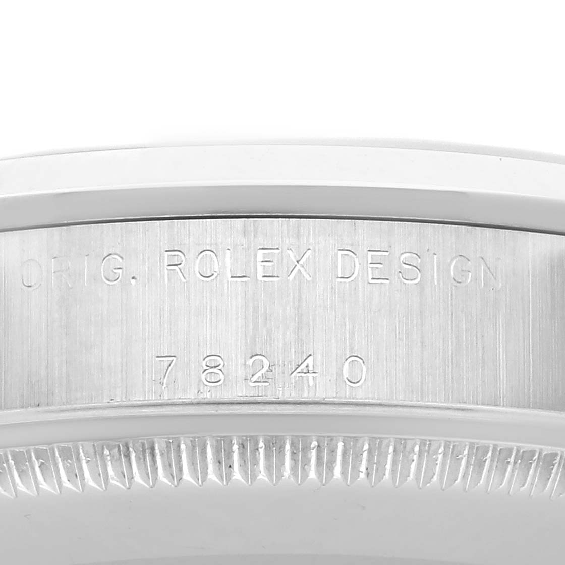 The image shows a close-up of the side of the Rolex Datejust 78240 Women's Stainless Steel White Dial 78240 Women's Stainless Steel White Dial, highlighting the engraved model number and fluted bezel.