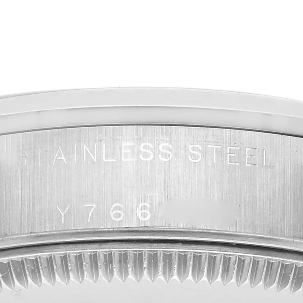 The image shows a close-up of the stainless steel case edge of a Rolex Datejust 78240 Women's Stainless Steel White Dial 78240 Women's Stainless Steel White Dial, highlighting its engraved markings.