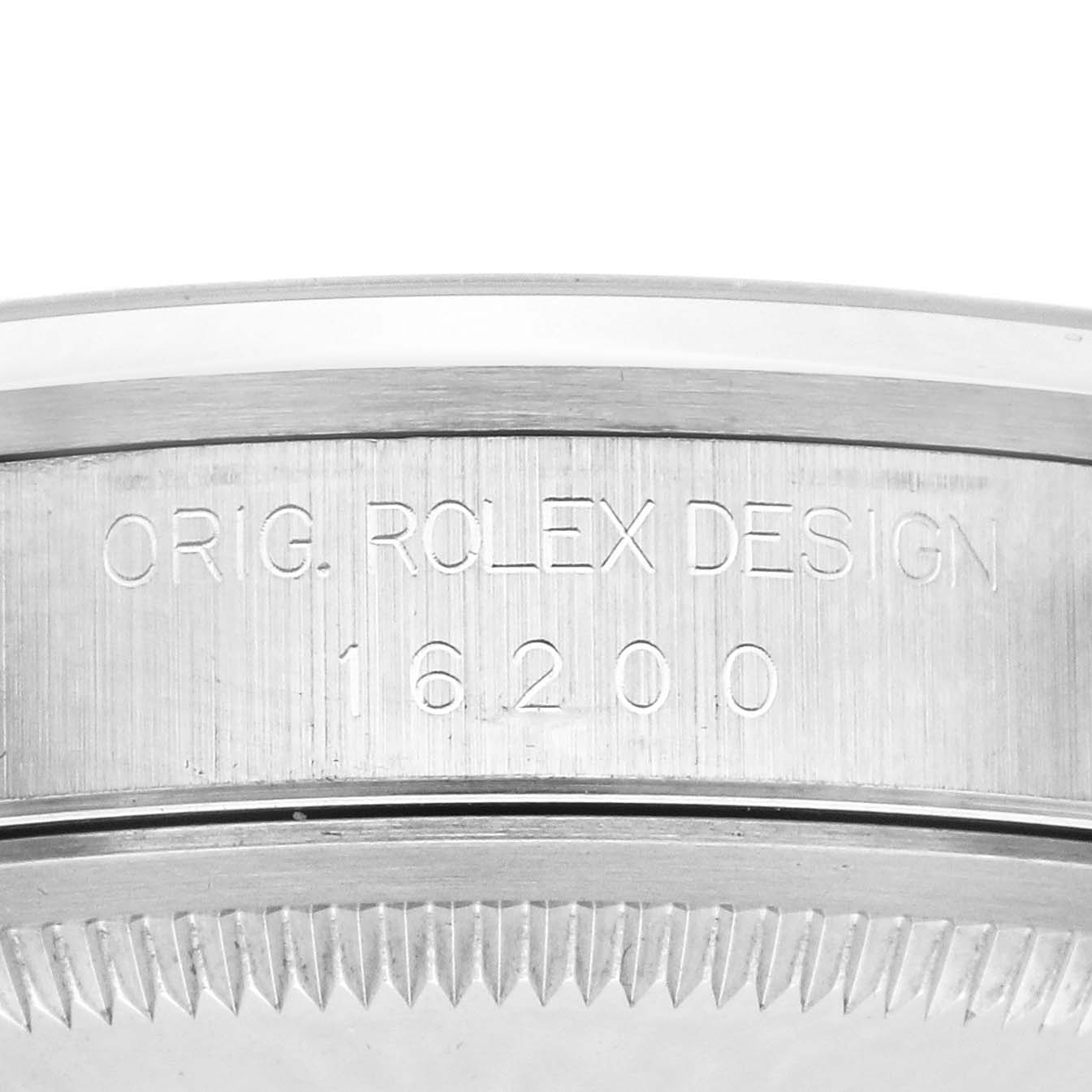 The image shows a close-up side view of the case between the lugs on a Rolex Datejust 16200 Men's White Gold Pink Dial 16200 Men's White Gold Pink Dial, with engraved model number and design.