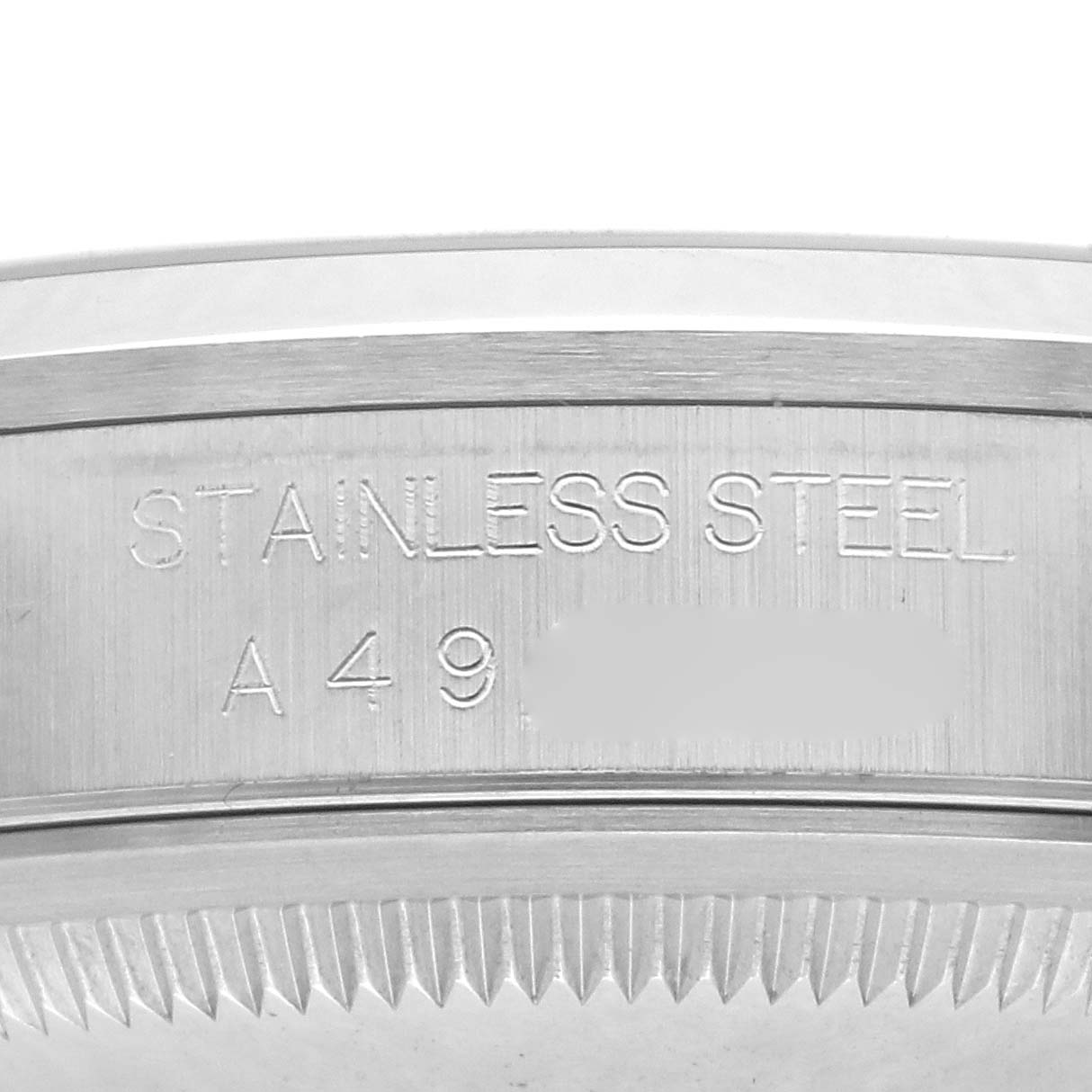 The image shows a close-up of the stainless steel engraved case back of a Rolex Datejust 16200 Men's White Gold Pink Dial 16200 Men's White Gold Pink Dial watch.