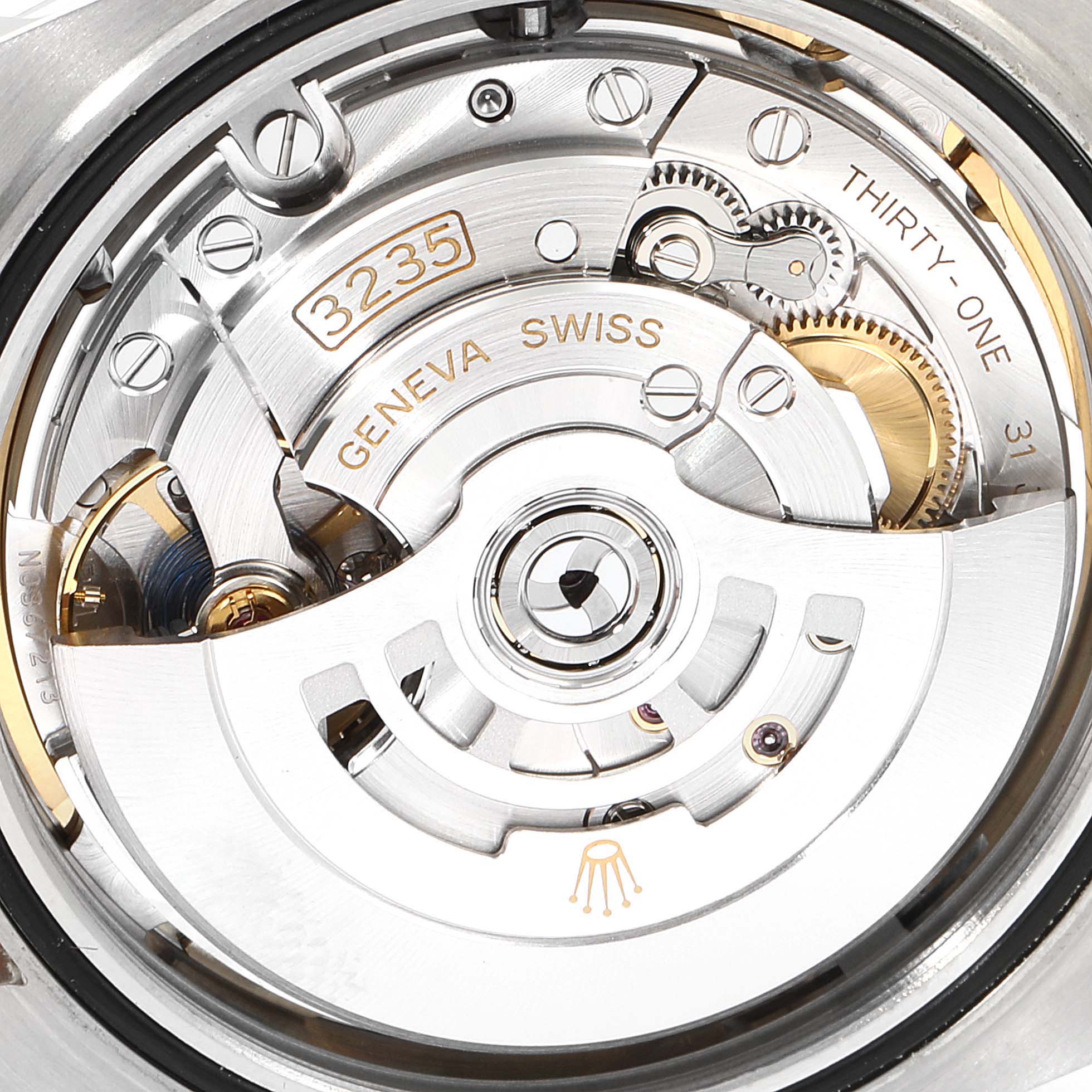 This image shows a close-up view of the movement inside a Rolex Datejust 41 126331 Men's Steel and Gold (two tone) Mother of Pearl Dial 126331 Men's Steel and Gold (two tone) Mother of Pearl Dial model, highlighting its intricate mechanical parts.