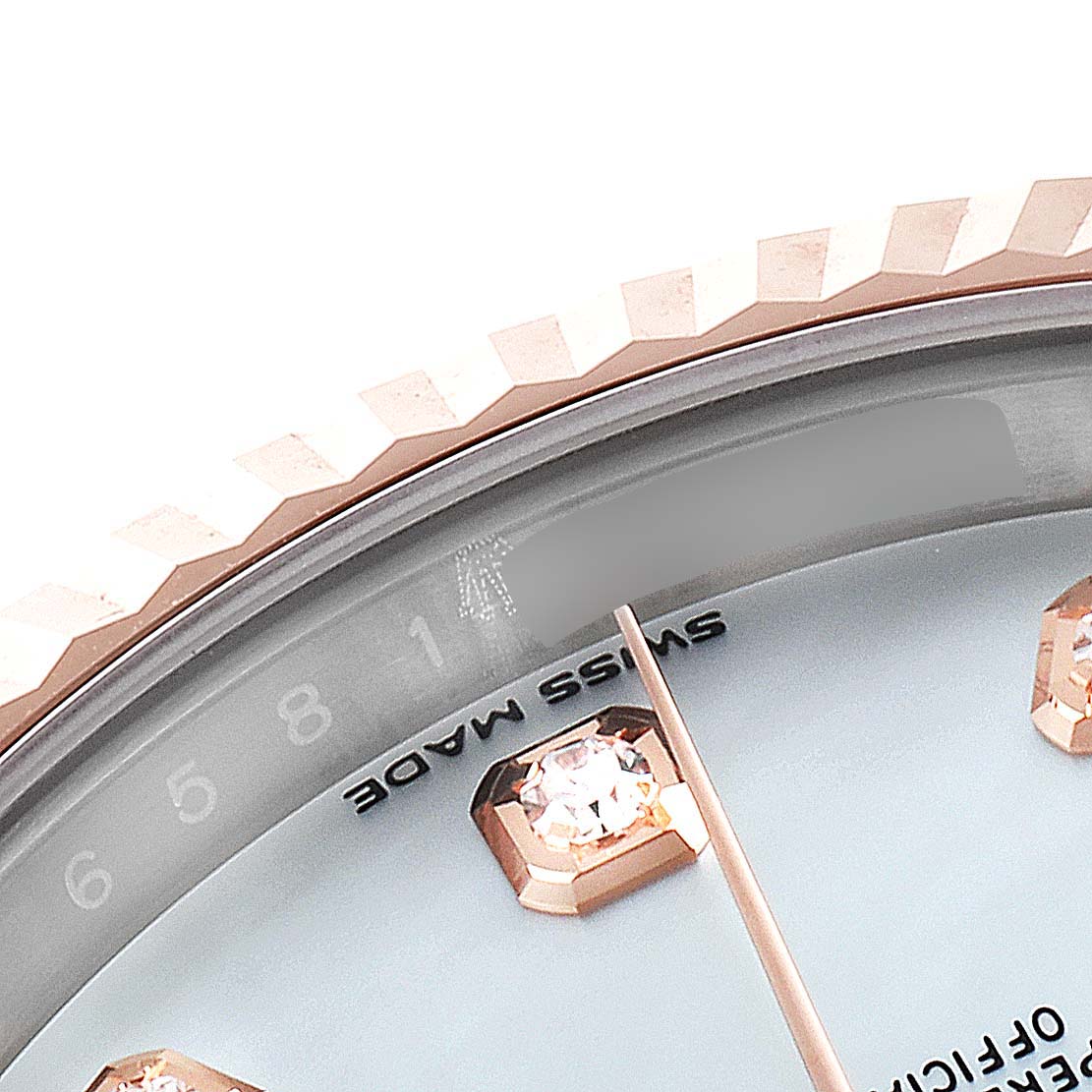 This image shows a close-up of the dial and fluted bezel of the Rolex Datejust 41 126331 Men's Steel and Gold (two tone) Mother of Pearl Dial 126331 Men's Steel and Gold (two tone) Mother of Pearl Dial model.