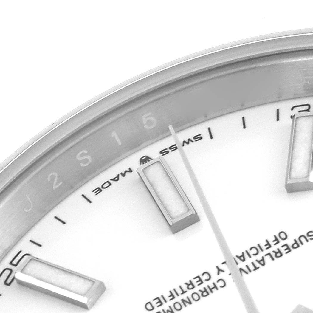 The image shows a close-up of the dial and bezel edge of a Rolex Datejust 41 126300 Men's Stainless Steel White Dial 126300 Men's Stainless Steel White Dial, displaying hour markers and part of the text.