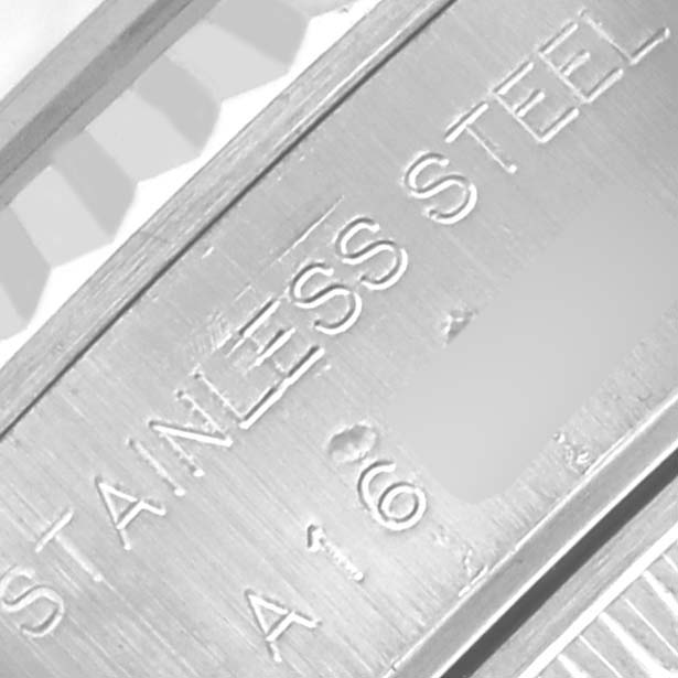 The image shows a close-up of the stainless steel bracelet of a Rolex Datejust 79174 Women's Stainless Steel Blue Dial 79174 Women's Stainless Steel Blue Dial watch, focusing on the engraved text.