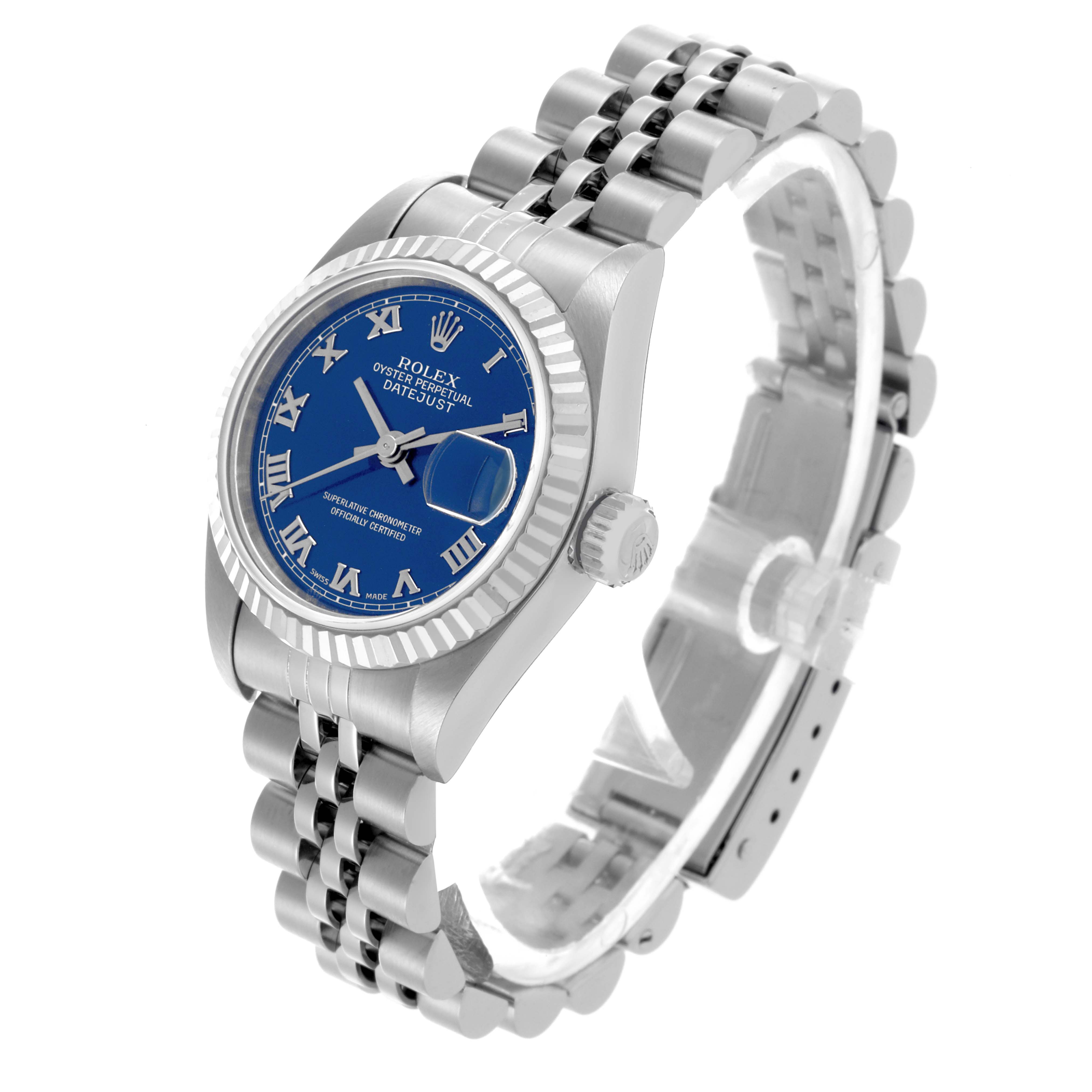 The Rolex Datejust 79174 Women's Stainless Steel Blue Dial 79174 Women's Stainless Steel Blue Dial watch is shown at a three-quarter angle, displaying the dial, fluted bezel, and jubilee bracelet.