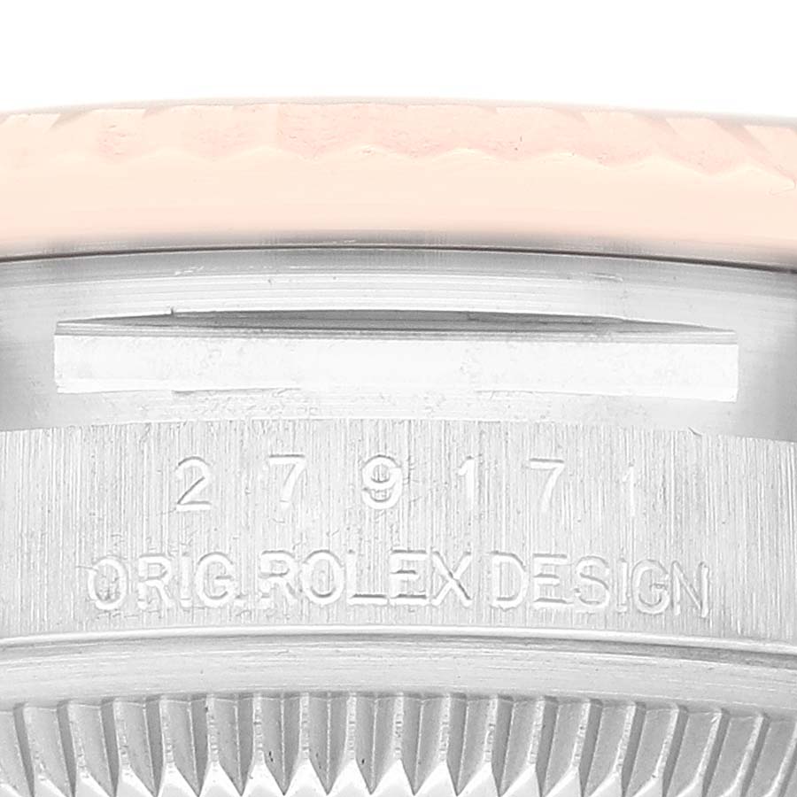 The image shows a close-up of the serial number and the "Orig Rolex Design" engraving on the side of a Rolex Datejust 279171 Women's Steel and Gold (two tone) Brown Dial 279171 Women's Steel and Gold (two tone) Brown Dial watch case.