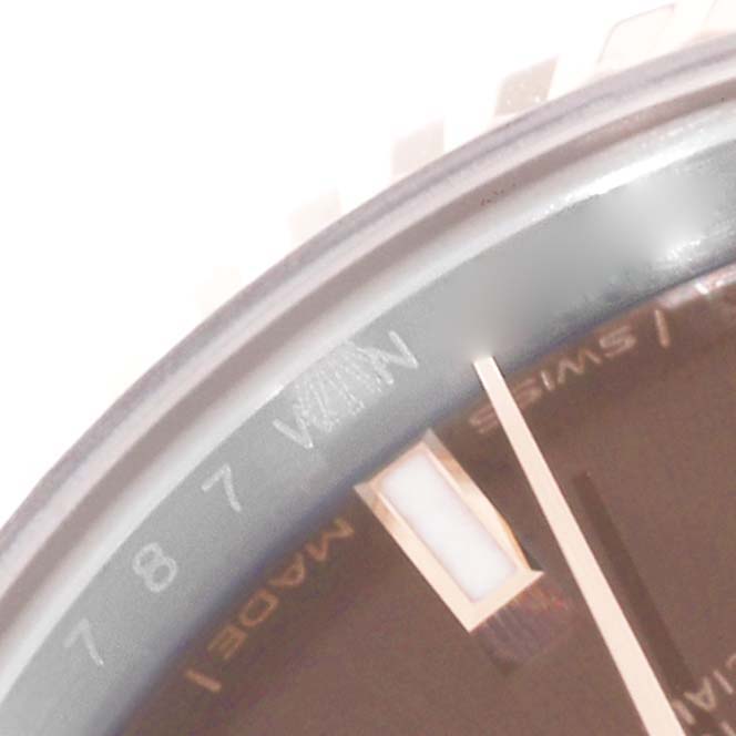 This image shows a close-up angle of the dial and bezel of a Rolex Datejust 279171 Women's Steel and Gold (two tone) Brown Dial 279171 Women's Steel and Gold (two tone) Brown Dial watch, highlighting the markers and part of the "Swiss Made" text.