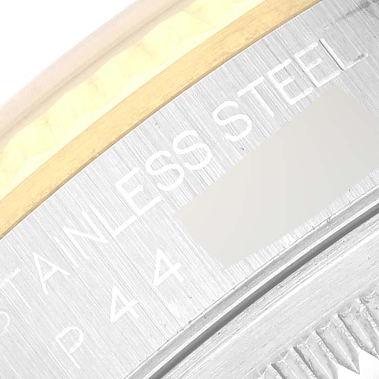 The image shows a close-up of the edge of the case back of a Rolex Datejust 16233 Men's Steel and Gold (two tone) Silver Dial 16233 Men's Steel and Gold (two tone) Silver Dial watch, highlighting the engravings and part of the bezel.