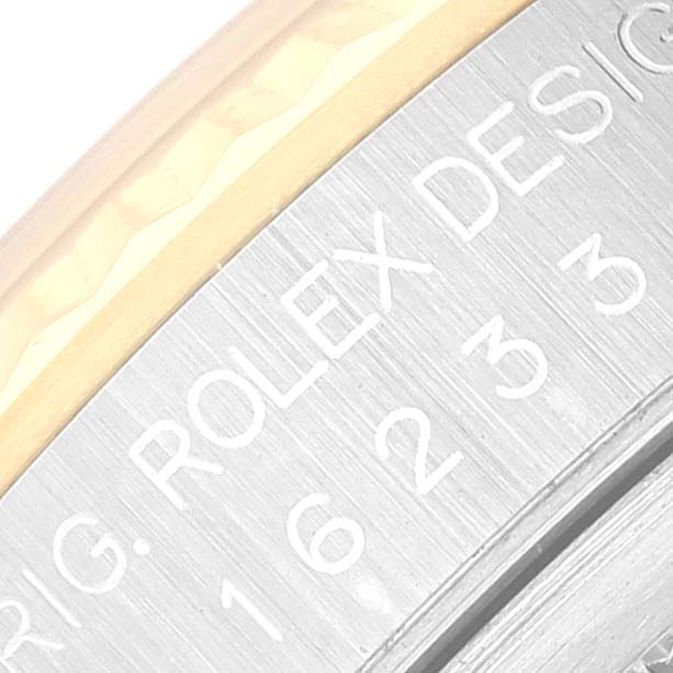 This close-up image shows part of the case back of a Rolex Datejust 16233 Men's Steel and Gold (two tone) Silver Dial 16233 Men's Steel and Gold (two tone) Silver Dial watch, highlighting the engraved text.