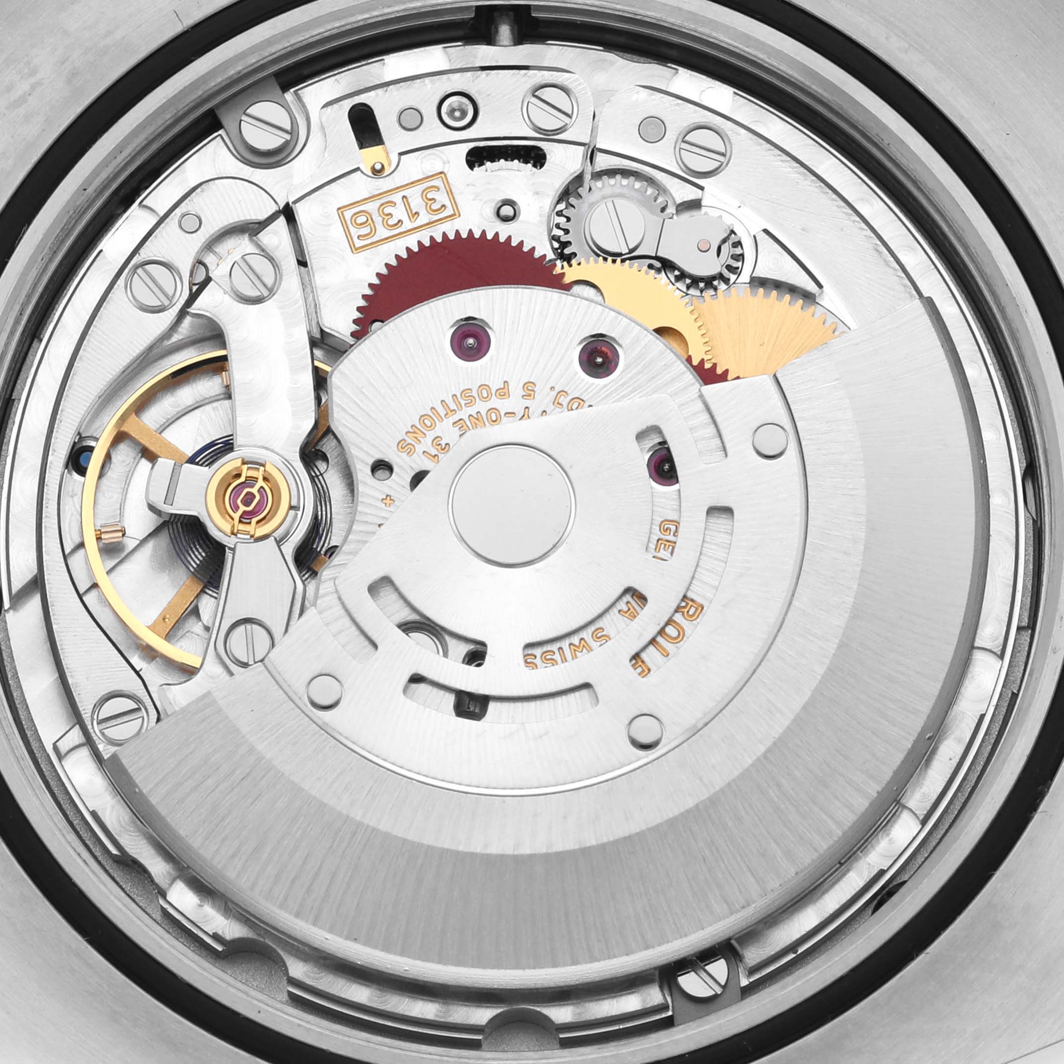 The image shows a close-up of the movement inside the Rolex Datejust 41 116333 Men's Steel and Gold (two tone) Black Dial 116333 Men's Steel and Gold (two tone) Black Dial, highlighting gears and mechanical components.