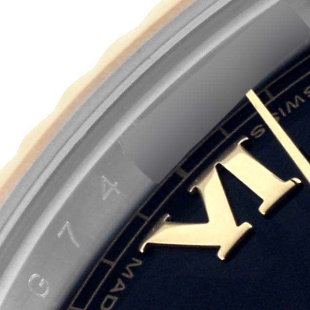 The image shows a close-up of the bezel and part of the dial of a Rolex Datejust 41 116333 Men's Steel and Gold (two tone) Black Dial 116333 Men's Steel and Gold (two tone) Black Dial watch, highlighting Roman numerals.