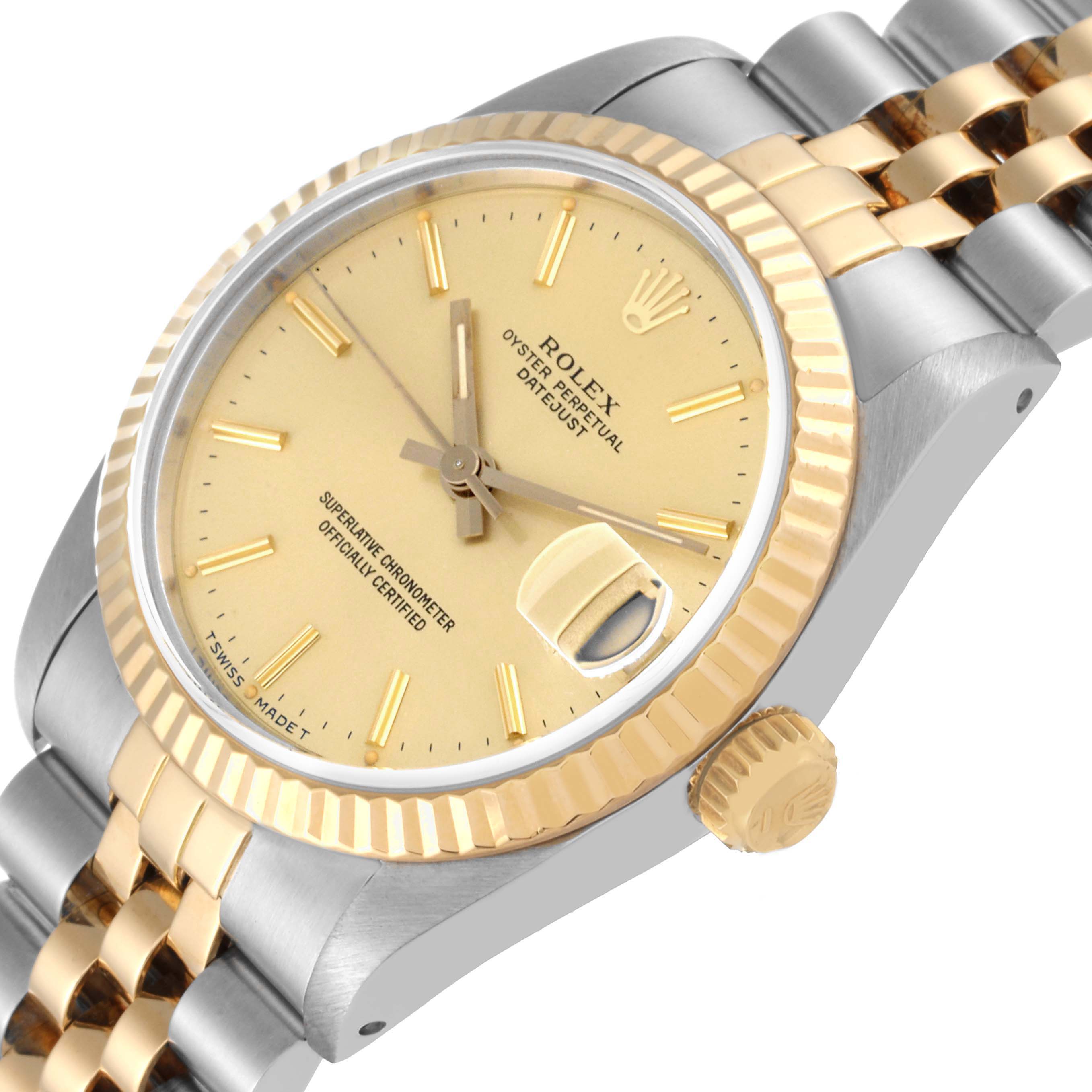 The image shows a Rolex Mid-Size 68273 Women
s Steel and Gold (two tone) Champagne Dial 68273 Women
s Steel and Gold (two tone) Champagne Dial Datejust watch from a front-side angle, highlighting its dial, bezel, crown, and bracelet.