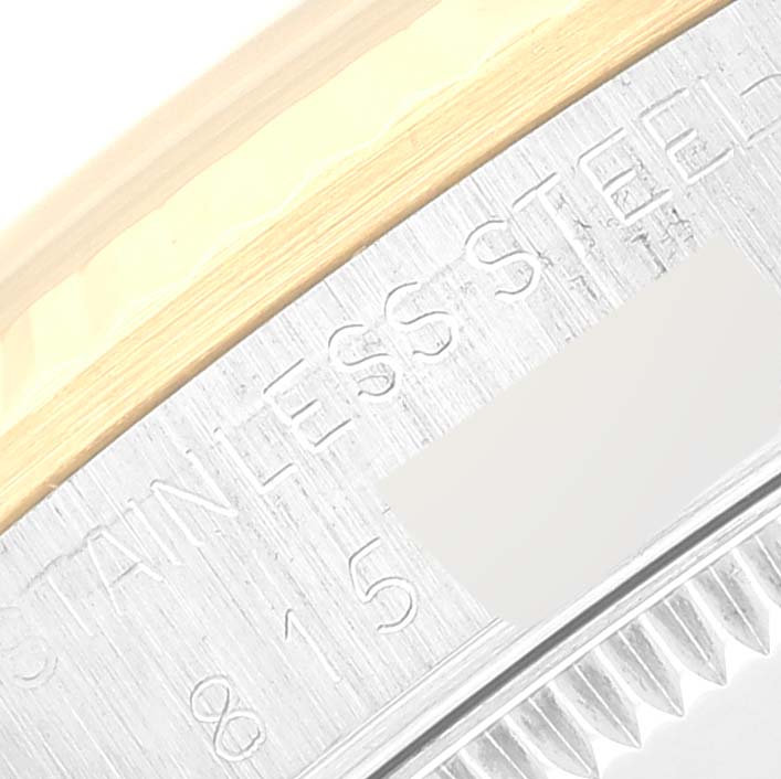 This image shows a close-up of the bezel and stainless steel part of a mid-size Rolex watch.