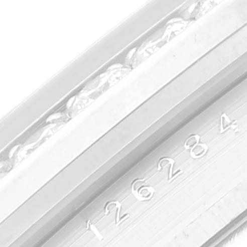 This image shows a close-up of the engraved model number and part of the bezel on a Rolex Datejust 126284RBR Men's Stainless Steel Purple Dial 126284RBR Men's Stainless Steel Purple Dial watch.