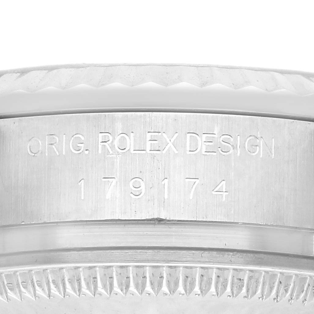 The image shows a close-up of the side engraving on a Rolex Datejust 179174 Women's Stainless Steel Silver Dial 179174 Women's Stainless Steel Silver Dial watch, displaying the design and model number.
