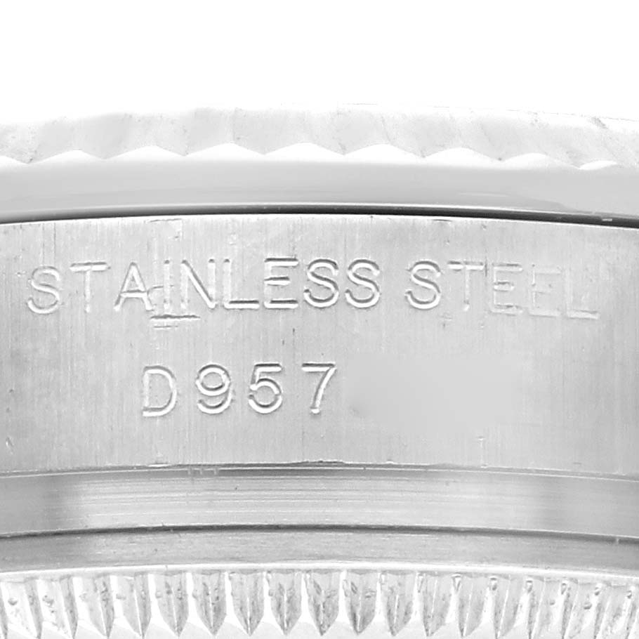 The image shows a close-up of the side engraving on a Rolex Datejust 179174 Women's Stainless Steel Silver Dial 179174 Women's Stainless Steel Silver Dial watch's stainless steel case.