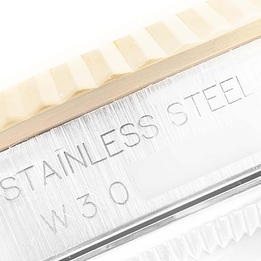 The image shows a close-up of the stainless steel bezel and case side of a Rolex Datejust 16233 Men's Steel and Gold (two tone) Black Dial 16233 Men's Steel and Gold (two tone) Black Dial watch.