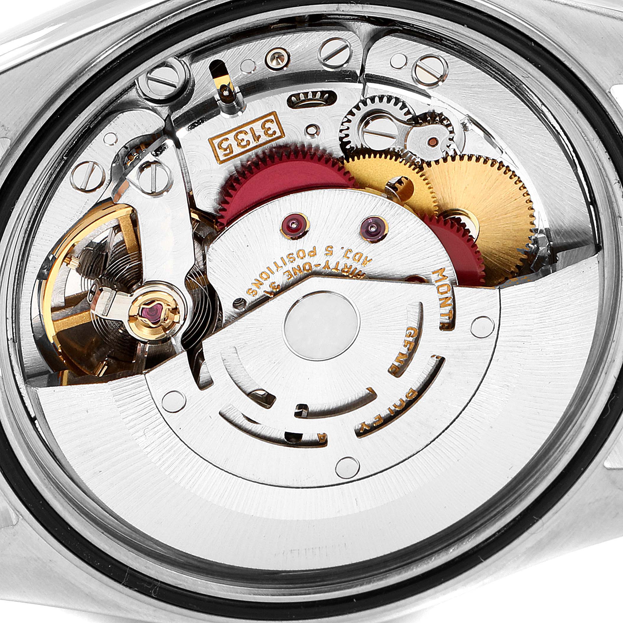 This image shows a close-up of the internal movement of a Rolex Datejust 16233 Men's Steel and Gold (two tone) Black Dial 16233 Men's Steel and Gold (two tone) Black Dial watch, highlighting the gears and mechanical components.