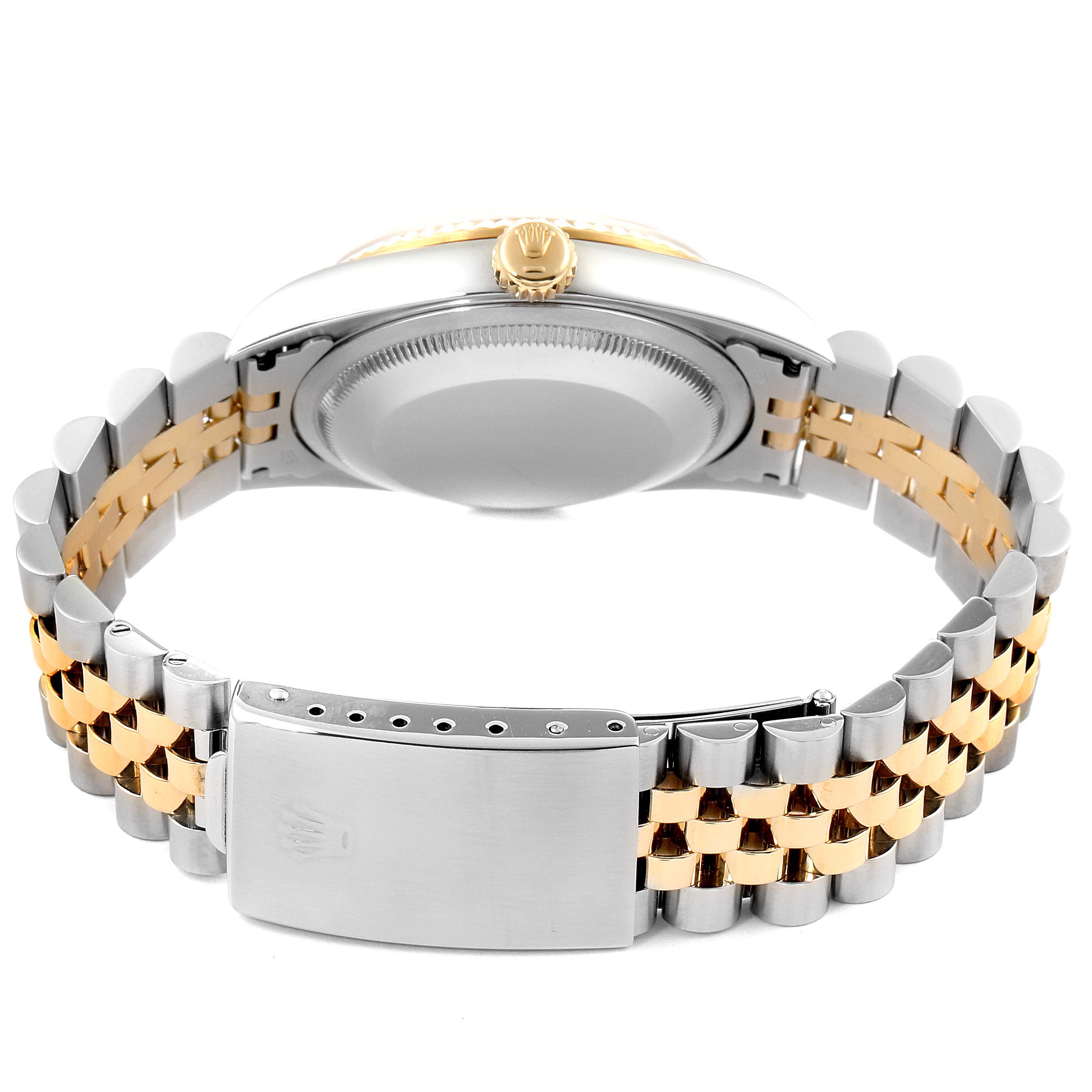 This image shows the back and clasp of a Rolex Datejust 16233 Men's Steel and Gold (two tone) Black Dial 16233 Men's Steel and Gold (two tone) Black Dial watch, highlighting its two-tone bracelet.