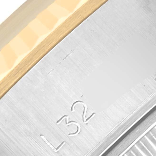 The image shows a close-up of the bezel and case edge of a Rolex Datejust 69173 Women's Steel and Gold (two tone) Champagne Dial 69173 Women's Steel and Gold (two tone) Champagne Dial, highlighting the engraved part.