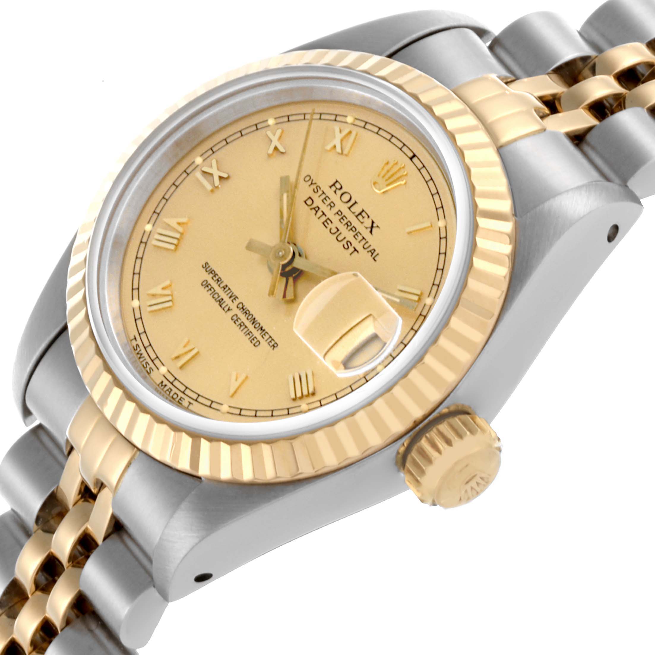 The Rolex Datejust 69173 Women's Steel and Gold (two tone) Champagne Dial 69173 Women's Steel and Gold (two tone) Champagne Dial watch is shown at an angled view, displaying the gold dial, fluted bezel, crown, and Jubilee bracelet.
