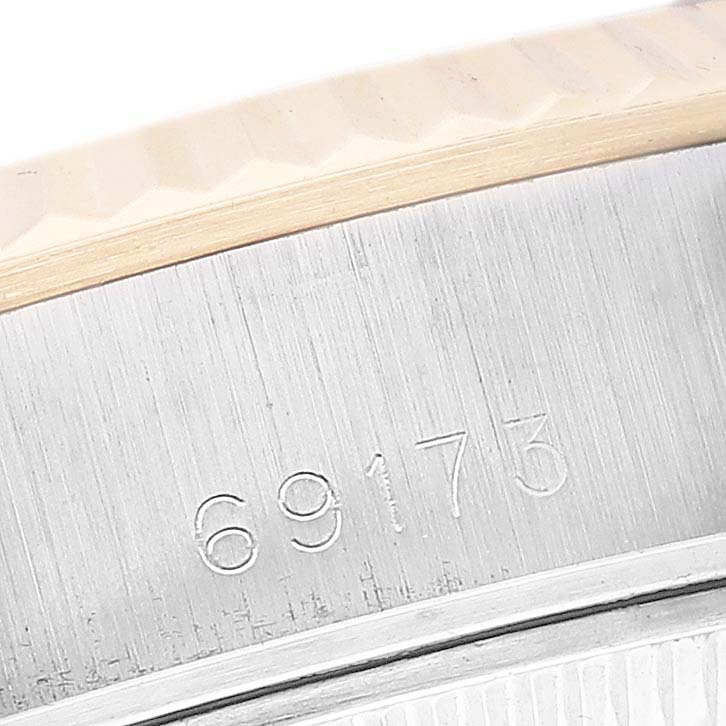 This image shows a close-up angle of the case side and model number "69173" of a Rolex Datejust 69173 Women's Steel and Gold (two tone) White Dial 69173 Women's Steel and Gold (two tone) White Dial watch.