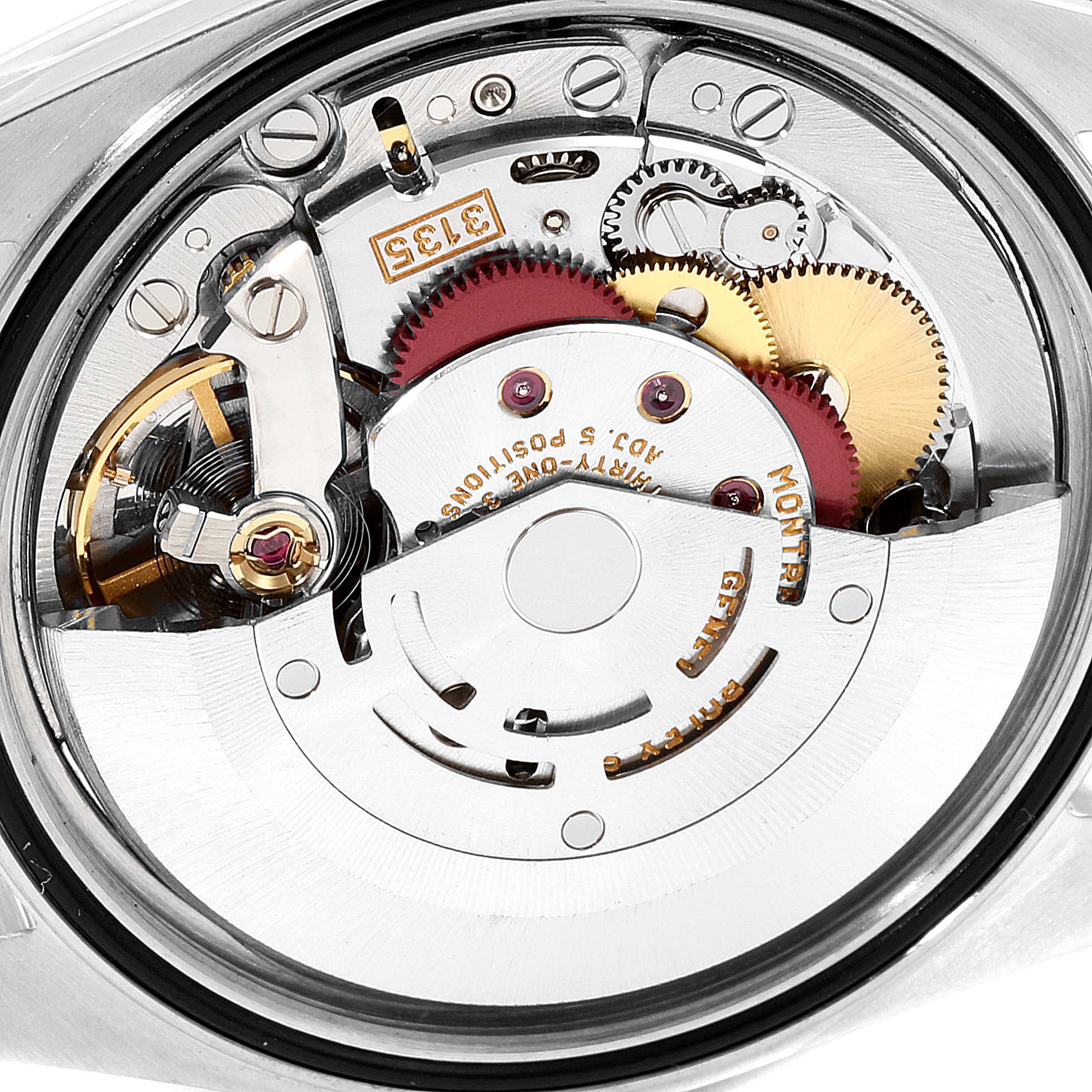 This is a close-up view of the movement inside a Rolex Datejust 16233 Men's Steel and Gold (two tone) White Dial 16233 Men's Steel and Gold (two tone) White Dial watch, showcasing its intricate mechanical components.