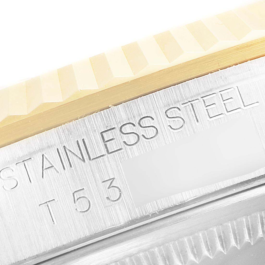 This image shows a close-up of the bezel and engraved text on the side of a Rolex Datejust 16233 Men's Steel and Gold (two tone) White Dial 16233 Men's Steel and Gold (two tone) White Dial watch.