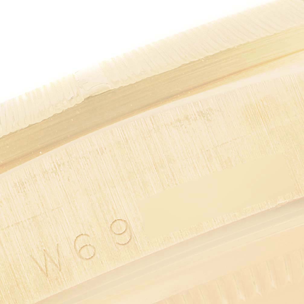 This close-up image shows part of the case back or inner frame with the engraved text on a Rolex President 18248 Men's Yellow Gold Silver Dial 18248 Men's Yellow Gold Silver Dial model watch.