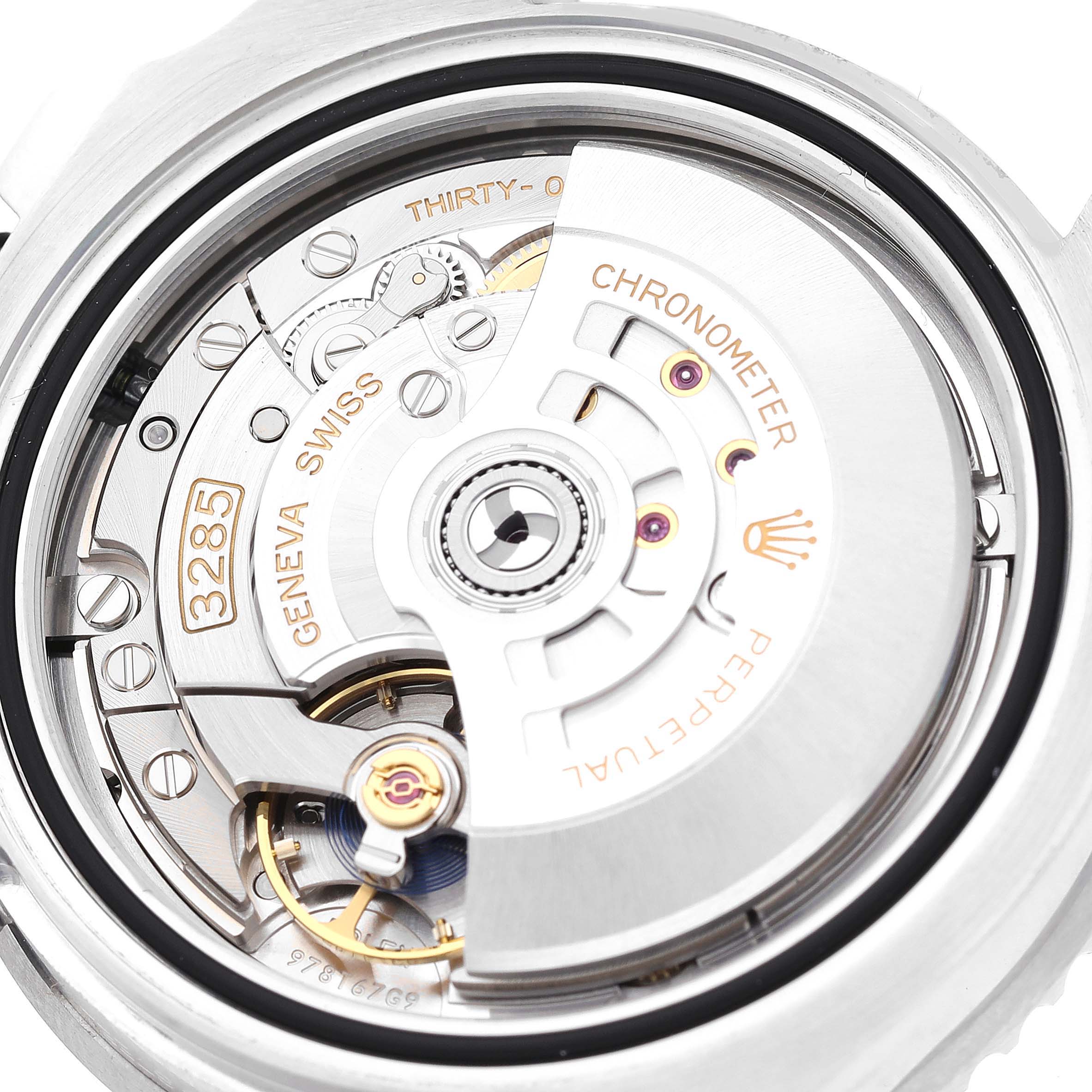The image shows a close-up view of the movement mechanism of a Rolex GMT-Master 126710 Men's Stainless Steel Black Dial 126710 Men's Stainless Steel Black Dial watch.