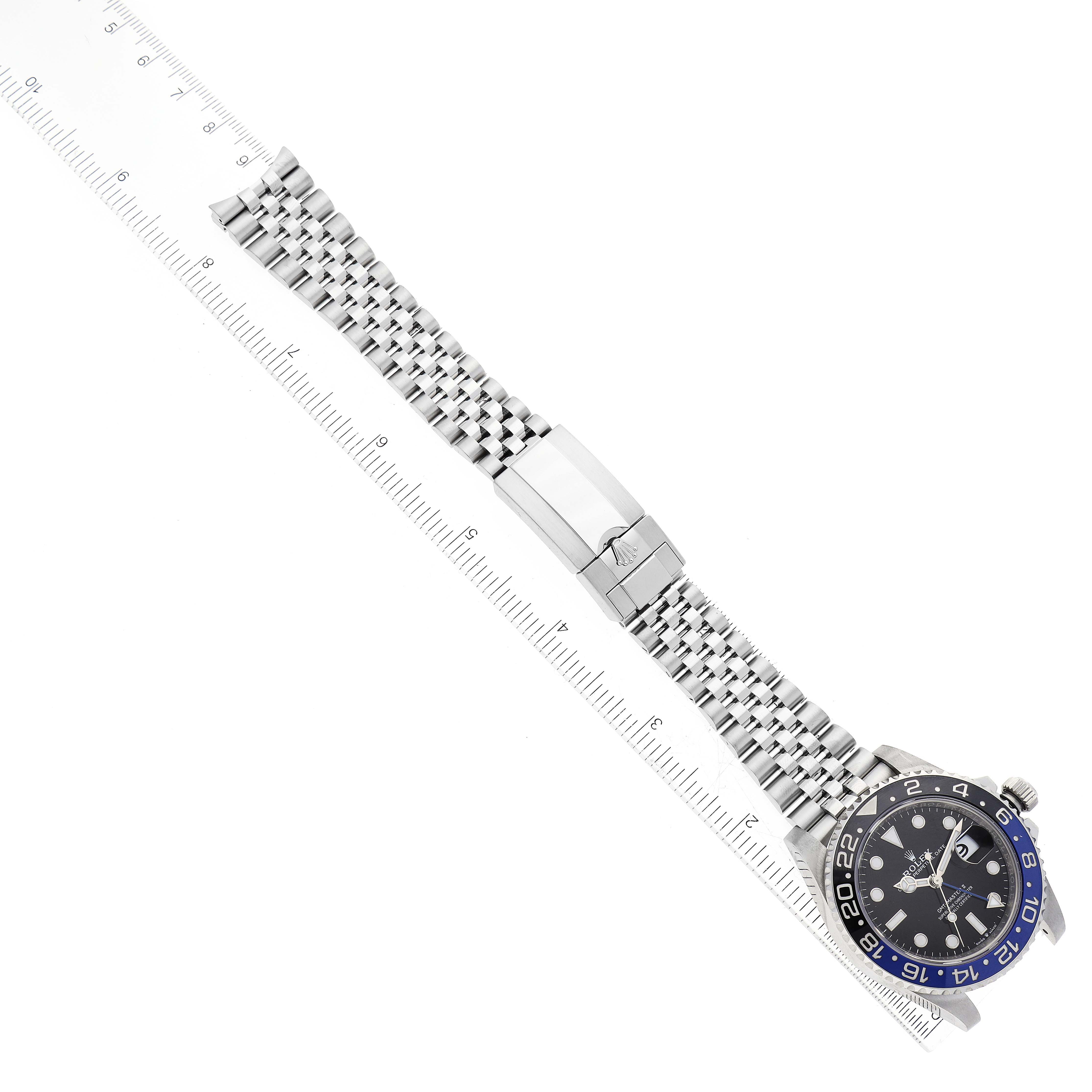 This image shows a top-down view of a Rolex GMT-Master 126710 Men's Stainless Steel Black Dial 126710 Men's Stainless Steel Black Dial watch, including the face, bezel, and metal bracelet with clasp.