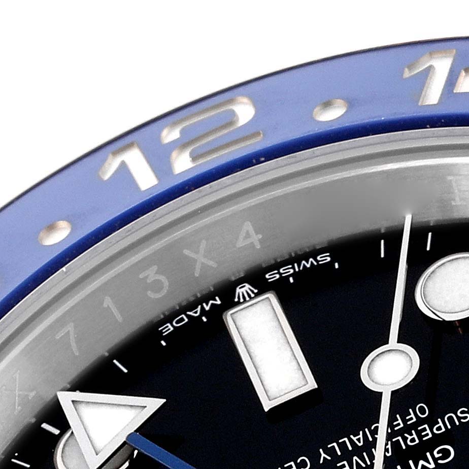 This close-up angle of the Rolex GMT-Master 126710 Men's Stainless Steel Black Dial 126710 Men's Stainless Steel Black Dial watch shows the bezel, part of the face, and details of the hour markers and hands.