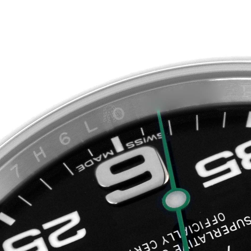 The image shows a close-up of the Rolex Air-King 116900 Men's Stainless Steel Black Dial 116900 Men's Stainless Steel Black Dial watch dial, highlighting the numerals and minute hand.