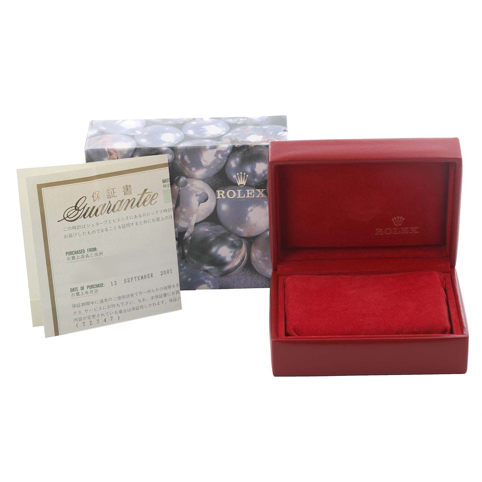 This image shows the packaging and guarantee card for a Rolex Oyster Perpetual 76080 Women's Stainless Steel Silver Dial 76080 Women's Stainless Steel Silver Dial watch, including a red box and branded exterior packaging.
