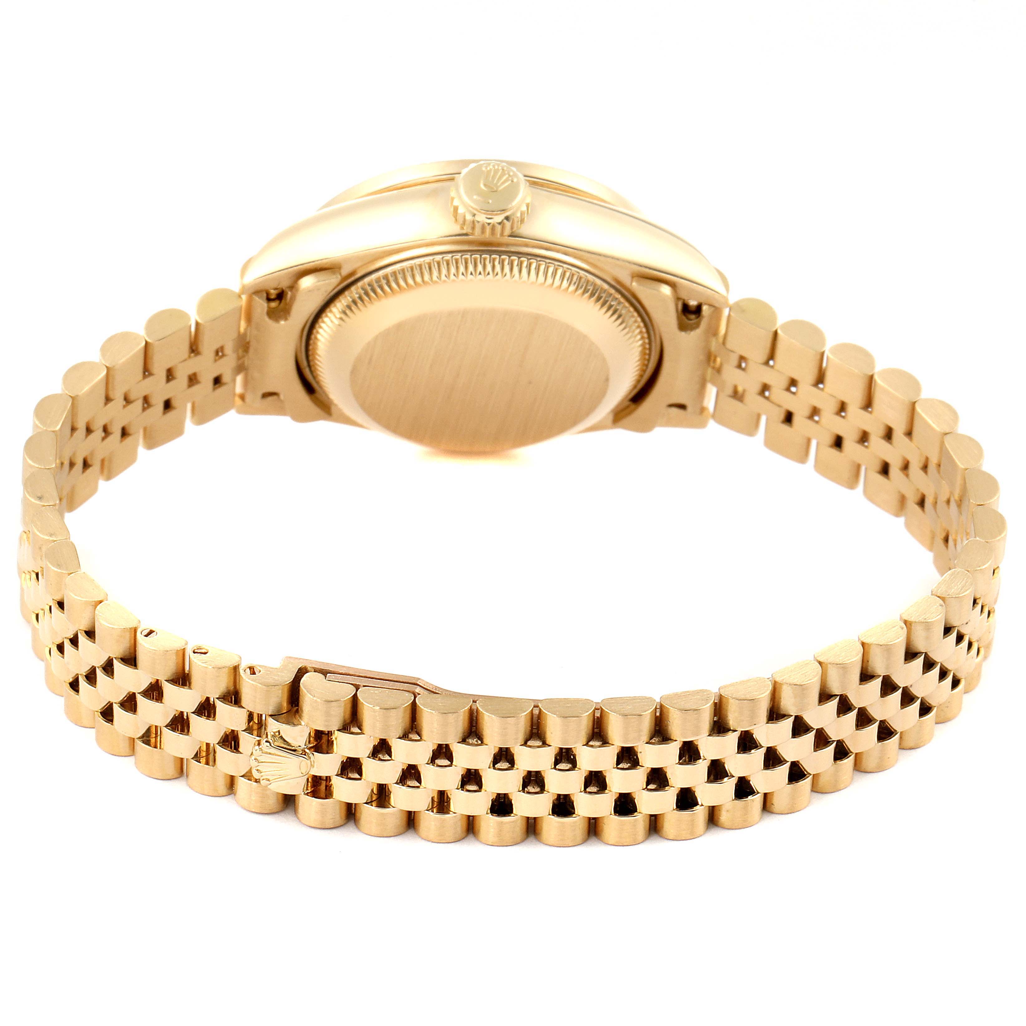 The image shows the back and bracelet of a Rolex President 69138 Women's Yellow Gold Black Dial 69138 Women's Yellow Gold Black Dial model watch from a rear angle.