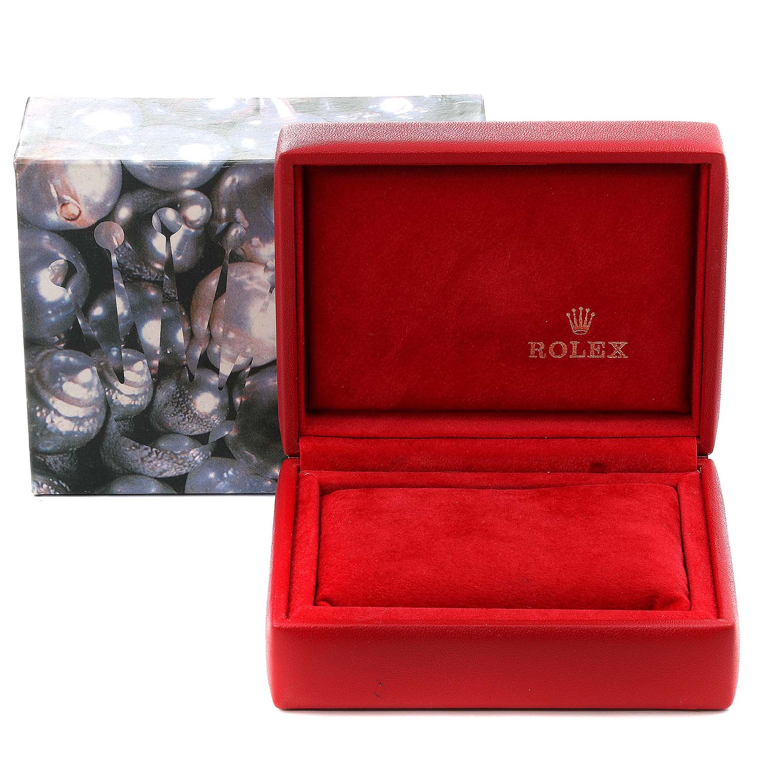 This image shows an open red Rolex watch box for the President model, placed next to its original outer packaging.