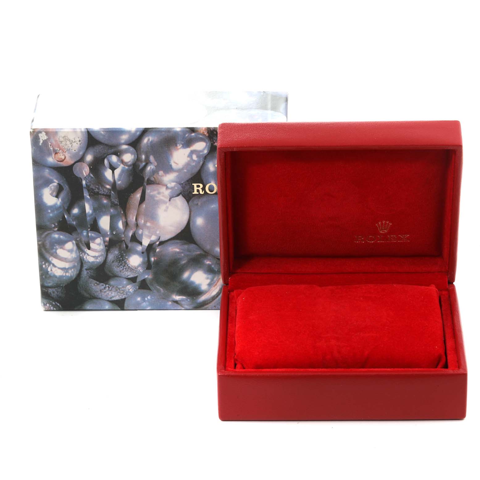 The image shows an empty red Rolex watch box and its outer packaging for the President model.