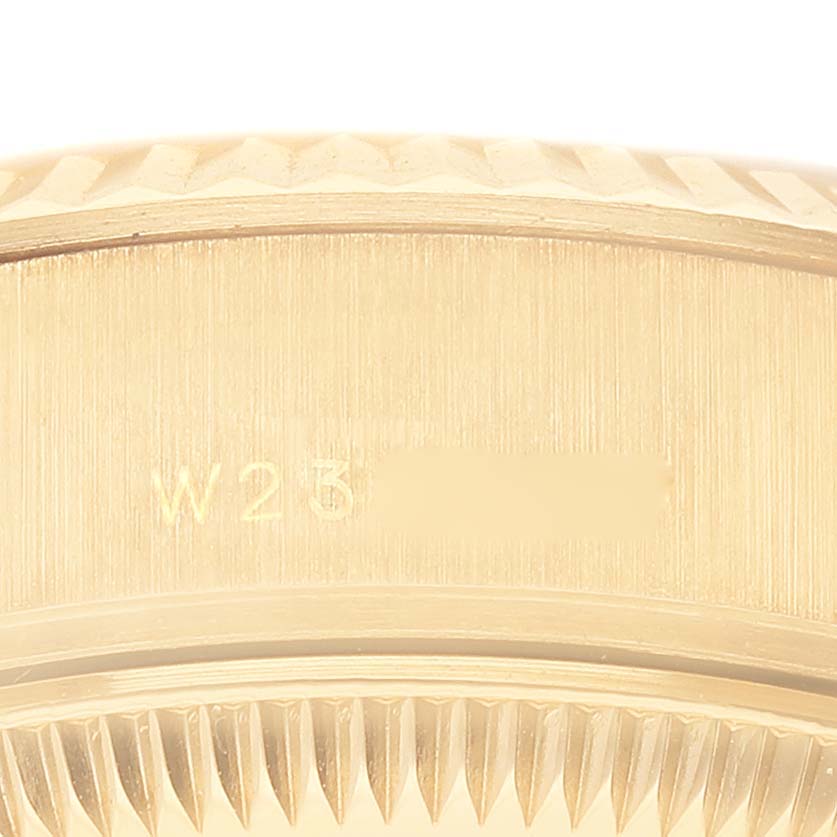 This close-up image shows the case's edge and fluted bezel of a Rolex President 69178 Women's Yellow Gold Champagne Dial 69178 Women's Yellow Gold Champagne Dial model watch.