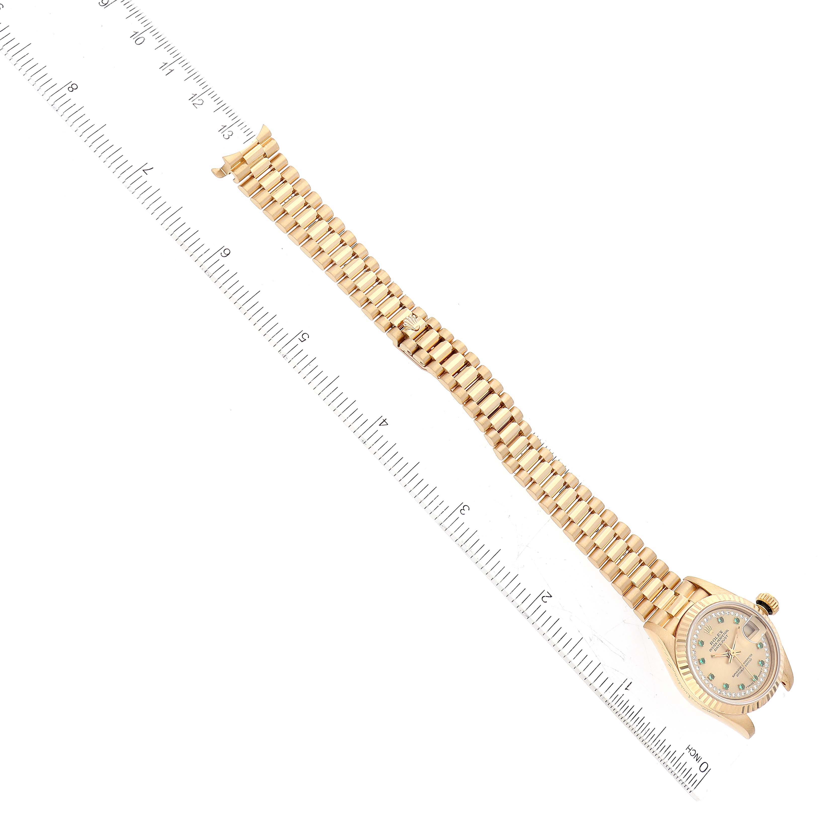 The image shows a top view of a Rolex President 69178 Women's Yellow Gold Champagne Dial 69178 Women's Yellow Gold Champagne Dial model watch with its gold bracelet and part of the dial visible.