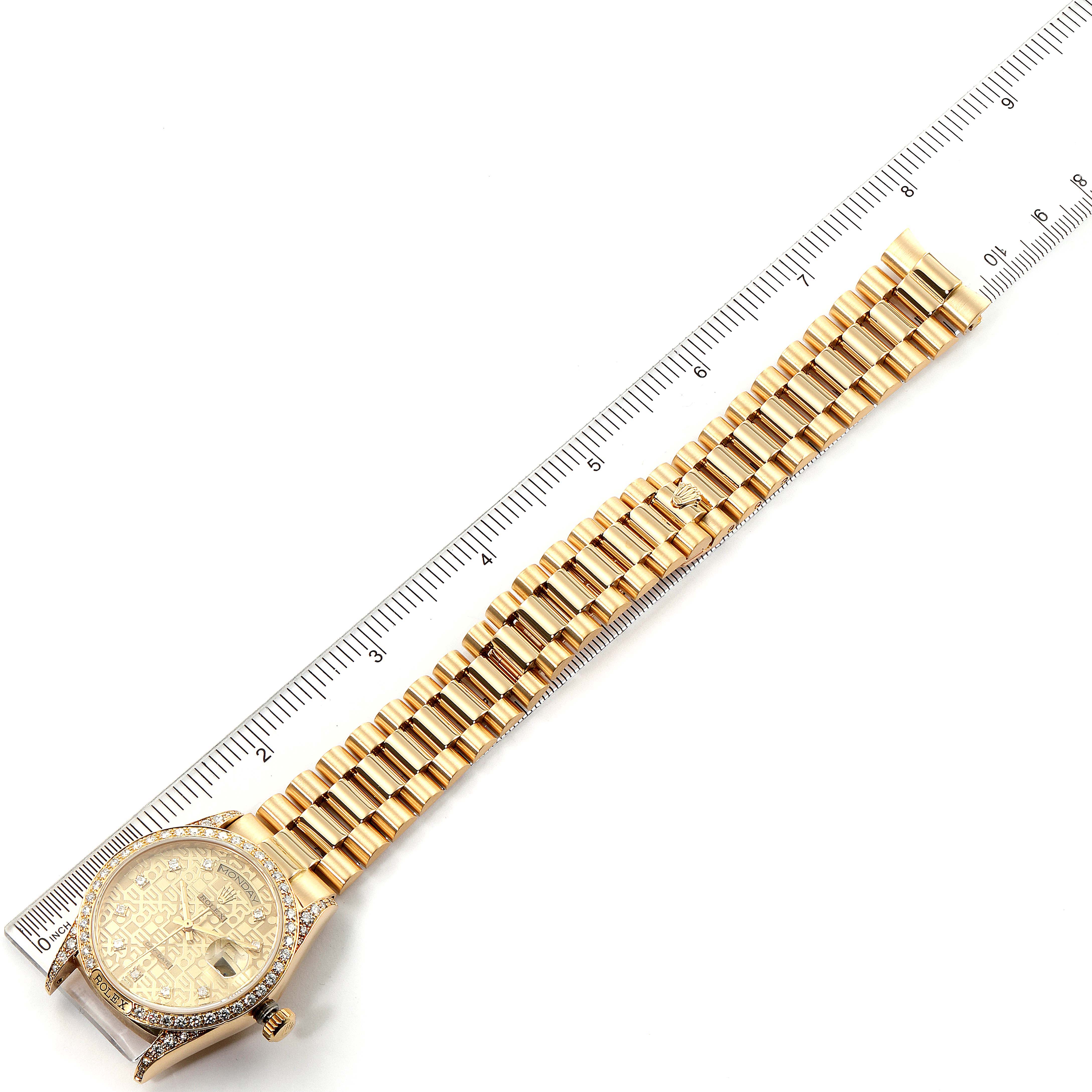 The image shows a Rolex President 18138 Men's Yellow Gold Champagne Dial 18138 Men's Yellow Gold Champagne Dial model watch at an overhead angle, displaying the face, bezel, and full bracelet against a ruler.