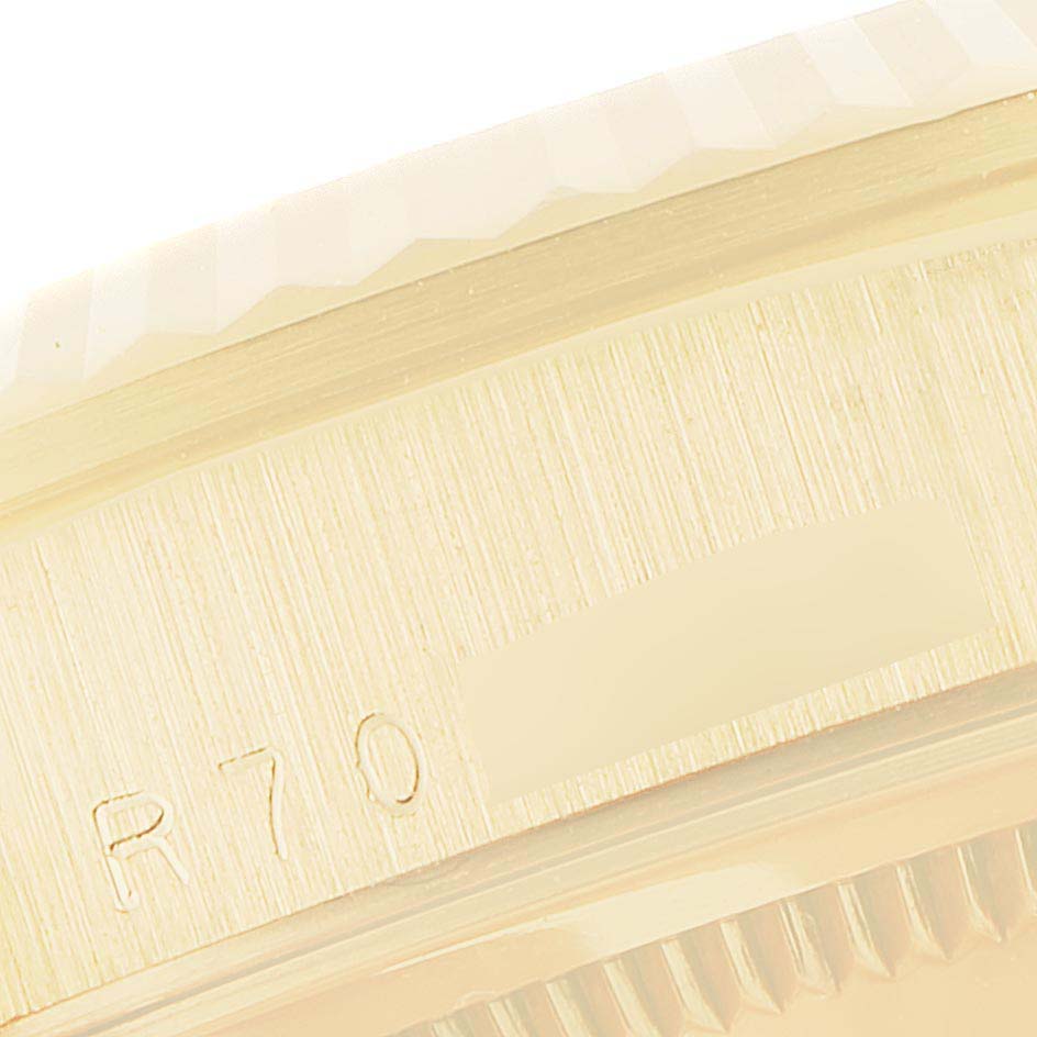 This close-up image shows the side and part of the bezel of a Rolex President 18238 Men's Yellow Gold Champagne Dial 18238 Men's Yellow Gold Champagne Dial model watch.